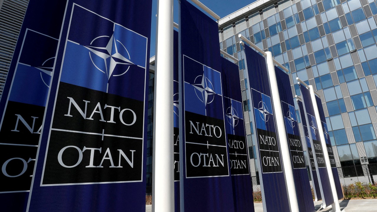 Banners at the NATO headquarters in Brussels. /Yves Herman/Reuters