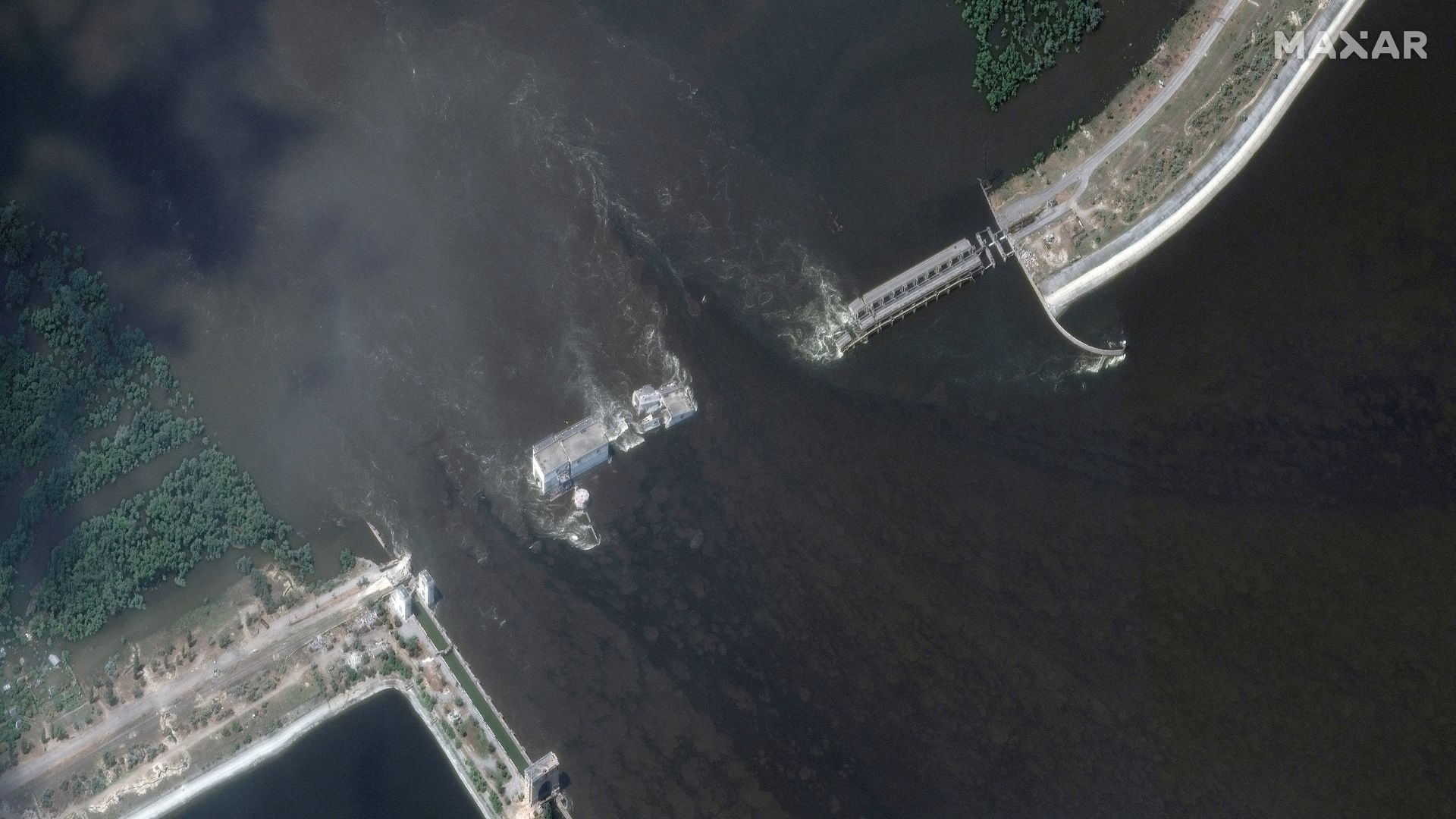 A satellite image shows the Nova Kakhovka dam after its breach. /Maxar Technologies/Handout via Reuters
