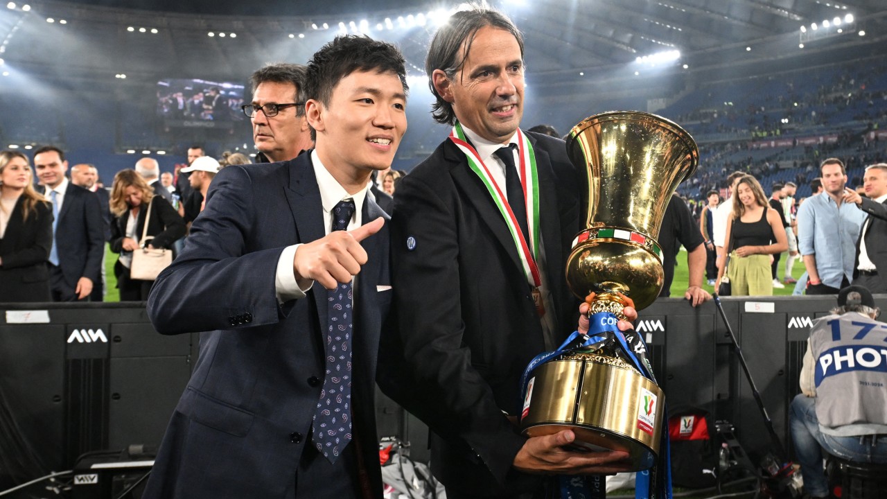 Zhang and coach Simone Inzaghi with the trophy after Inter retained the Coppa Italia. /Daniele Mascolo/Reuters