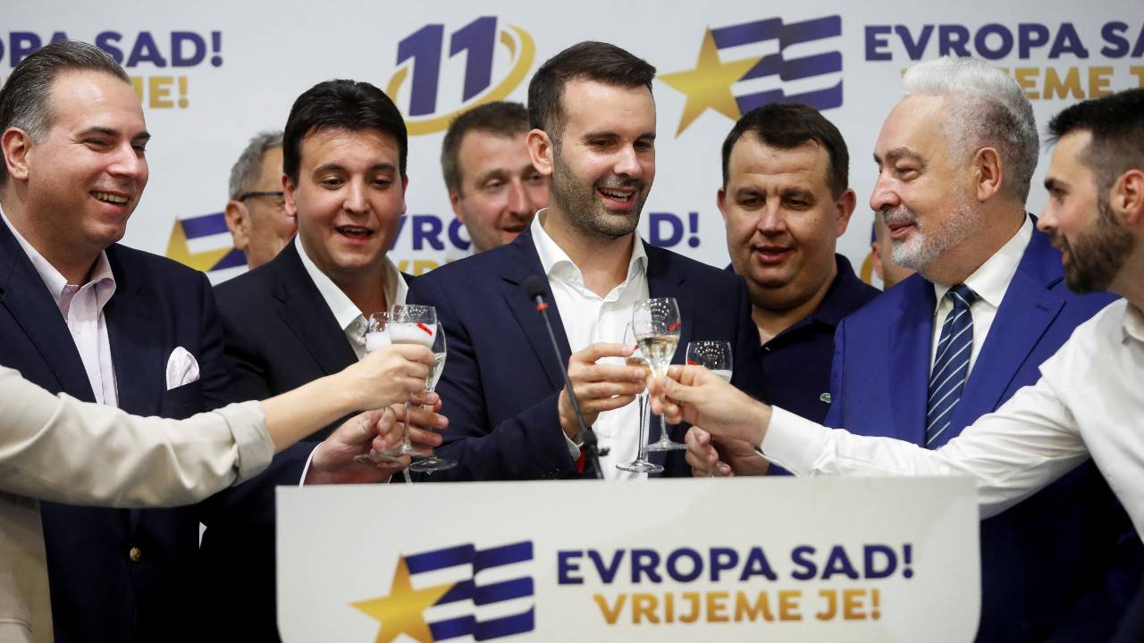 Milojko Spajic, leader of Europe Now, shares a toast on the day of Montenegro's snap parliamentary elections. /Stevo Vasiljevic/Reuters
