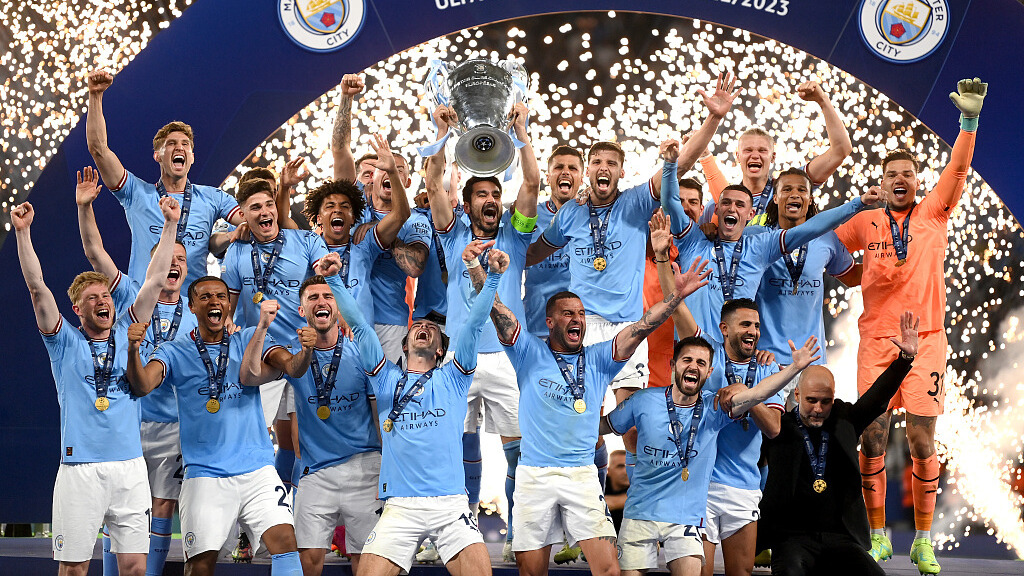 Ilkay Guendogan of Manchester City lifts the UEFA Champions League trophy after the team's victory in the UEFA Champions League 2022/23 final match. CFP/Michael Regan