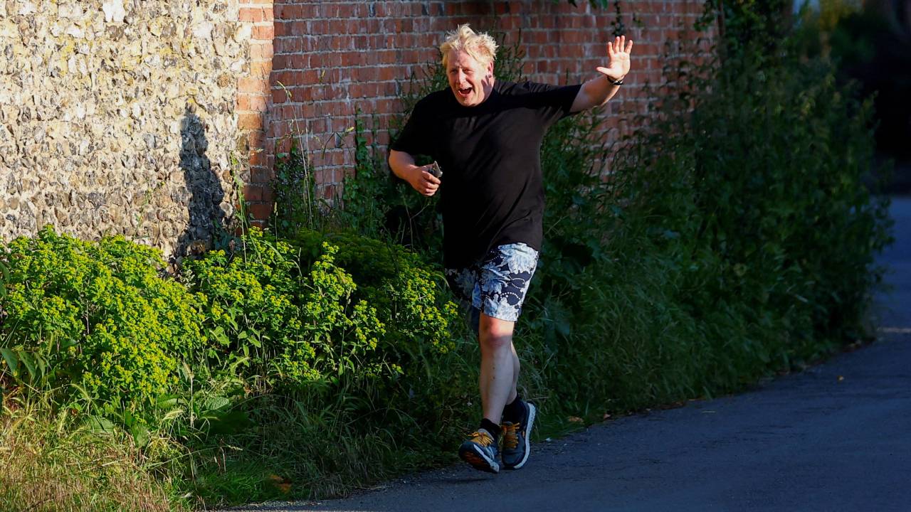 Former British Prime Minister Boris Johnson returns to his Oxfordshire home after running. Peter Cziborra/Reuters