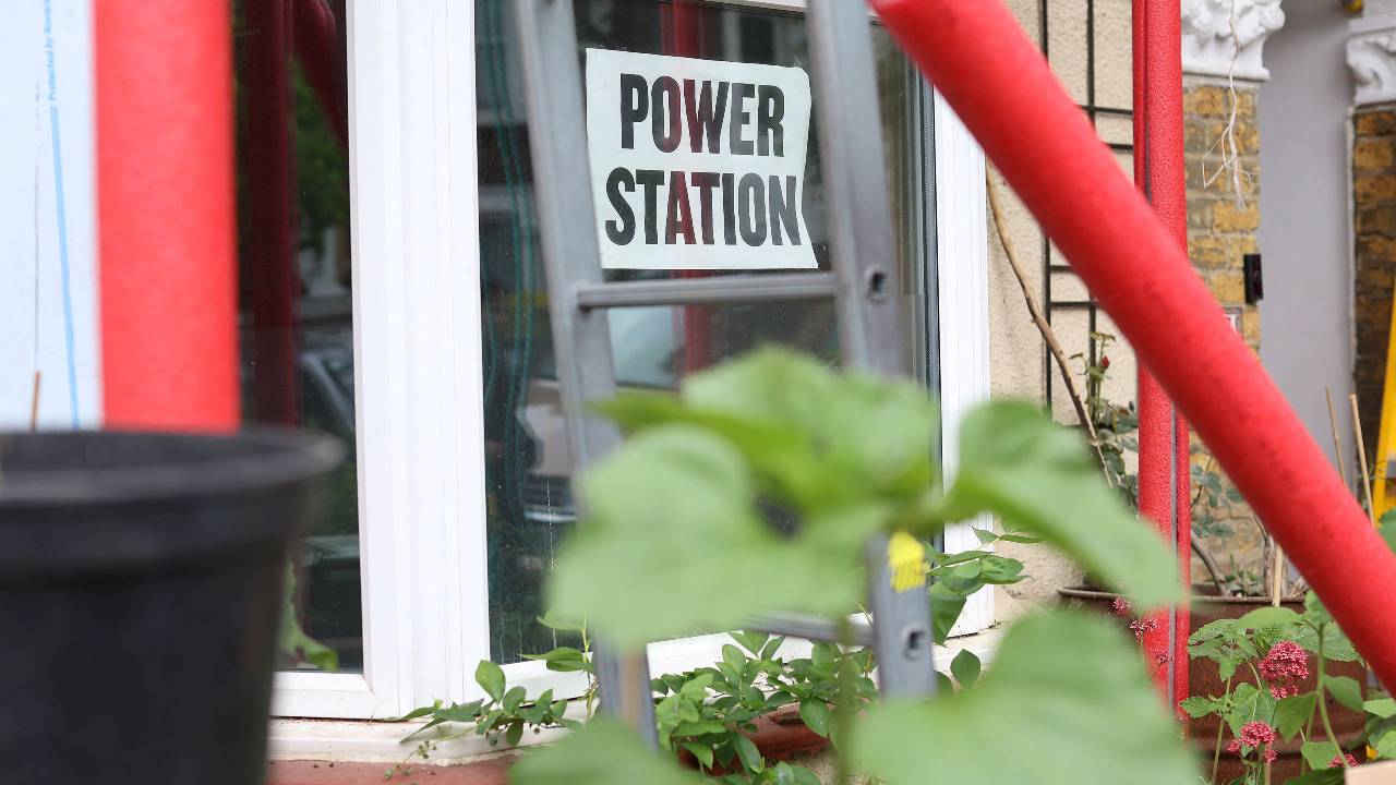 Artists Dan Edelstyn and Hilary Powell have helped turn their street in London into a hub for cheaper, climate-friendly energy. /Anna Gordon/Reuters