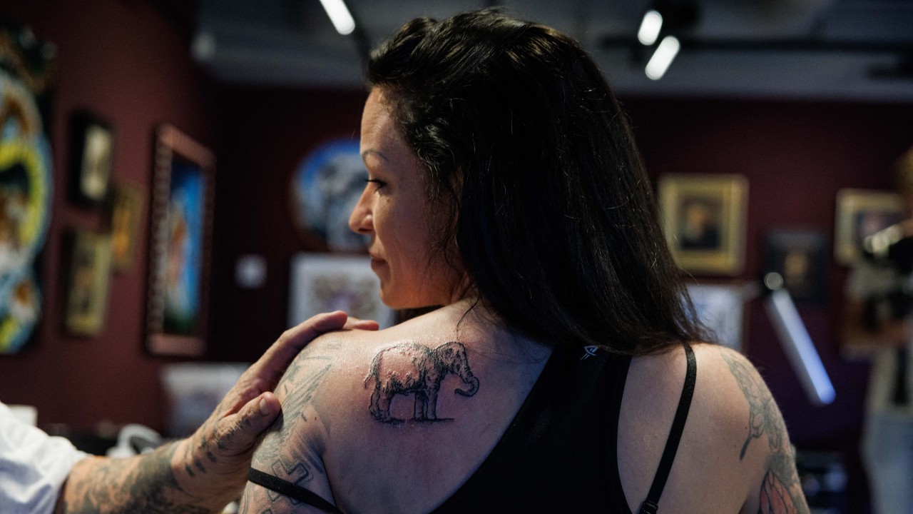 Museum worker Lilian Ramcharan got a 'Rembrandt's elephant' tattoo. /Simon Wohlfahrt/AFP