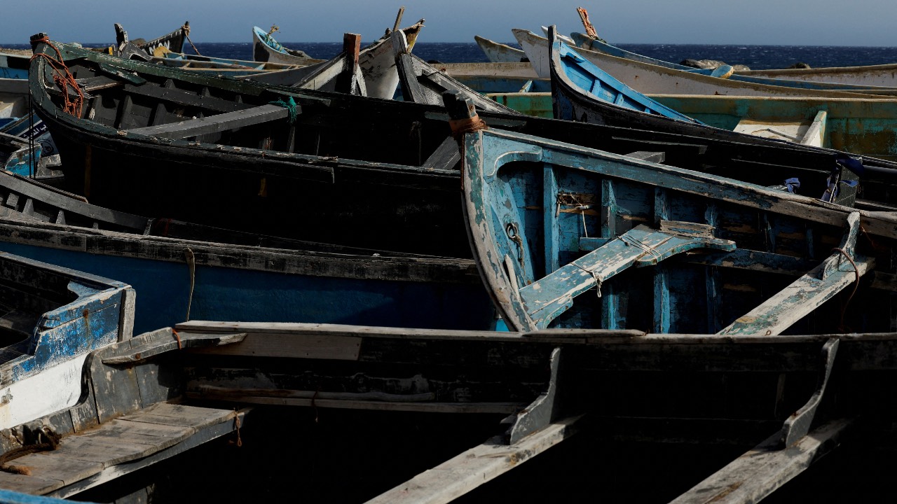 Dozens of wooden boats used by migrants to reach the Canary Islands are seen at the Port of Arinaga, in the island of Gran Canaria, Spain. /Borja Suarez/File photo/Reuters
