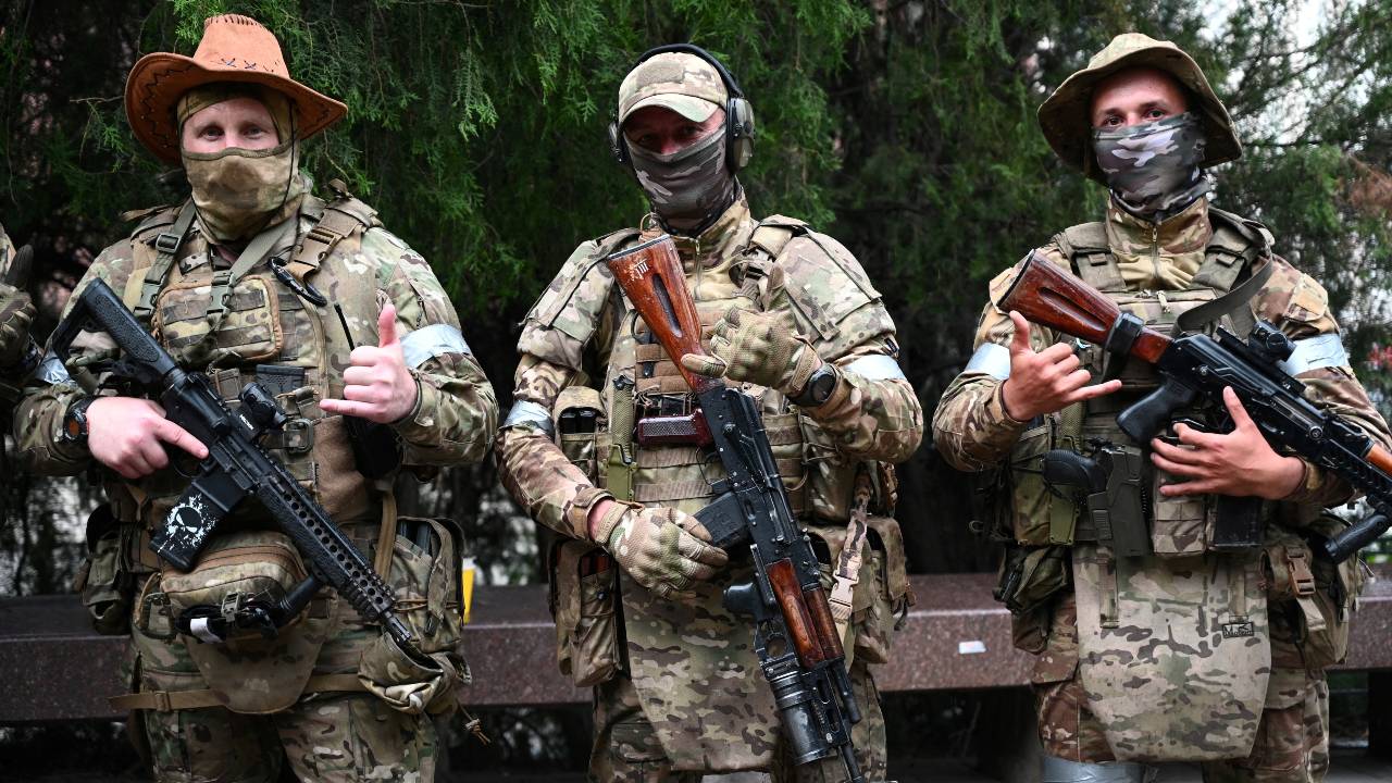 Fighters of Wagner private mercenary group pose for a picture as they get deployed in the Russian city of Rostov-on-Don. /Stringer/Reuters