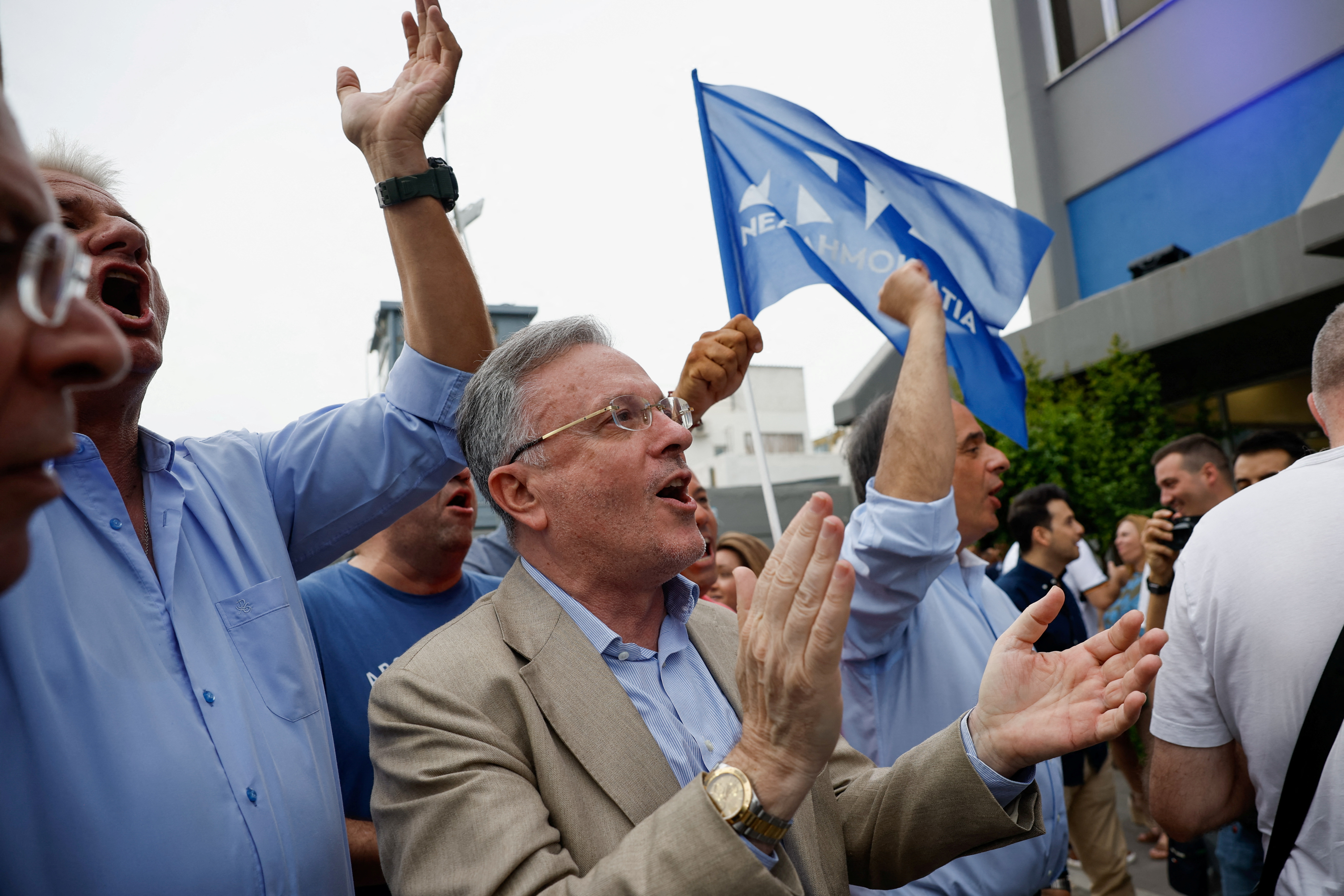 Supporters react joyously to the announcement of the first exit polls. /Louiza Vradi/ Reuters
