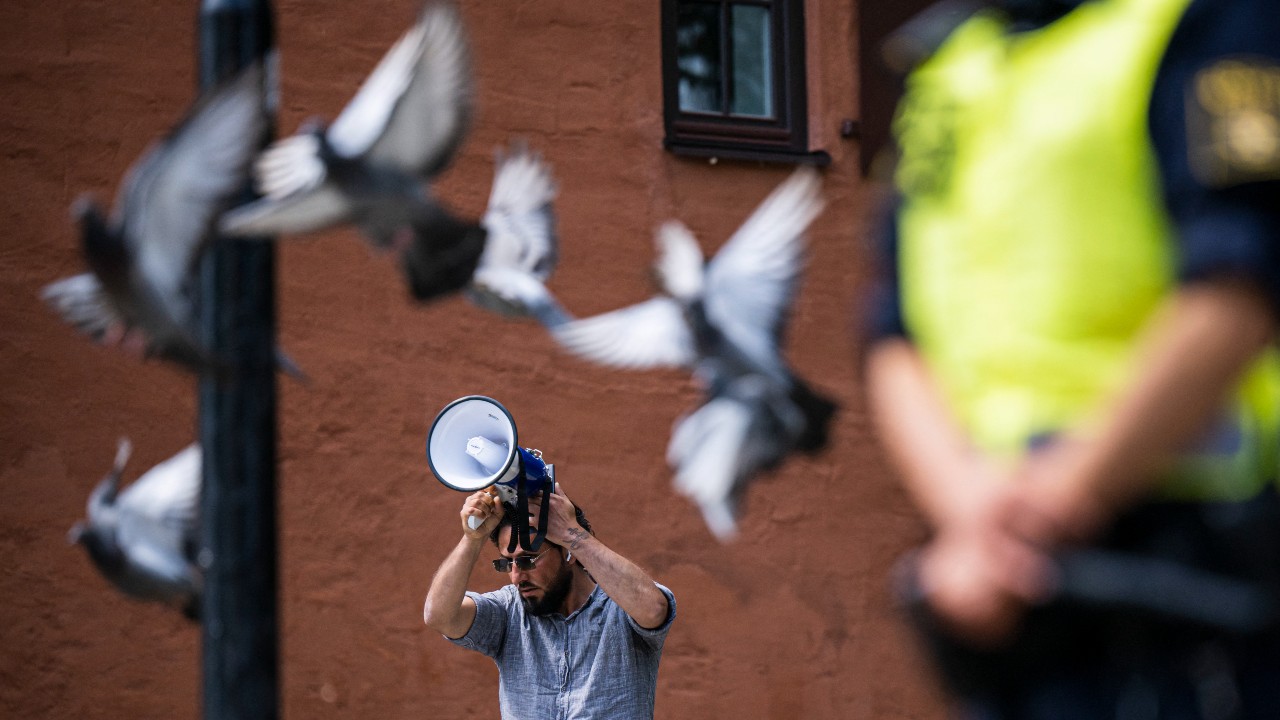 Salwan Momika protests outside a Stockholm mosque. /Jonathan Nackstrand/AFP