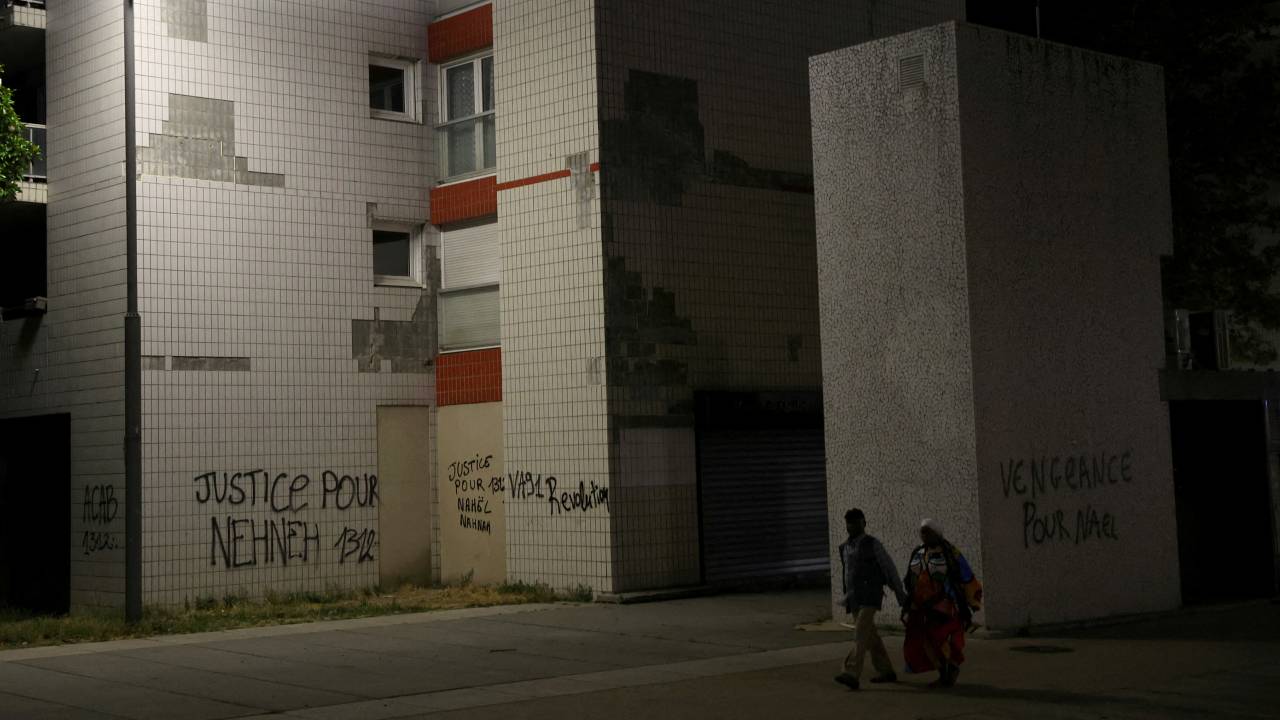 Phrases written on walls in a neighborhood where Nahel lived near Paris read 'Revenge for Nahel' and 'Justice for Nahel.' /Nacho Doce/Reuters