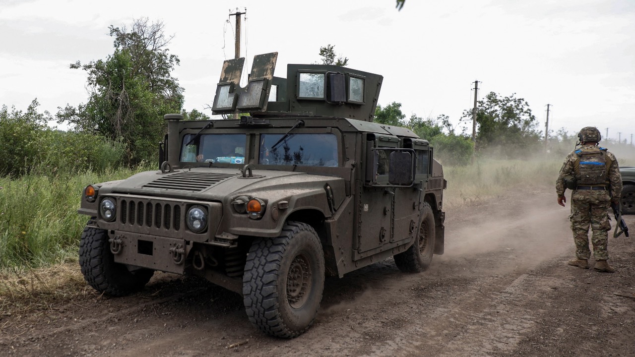 A HMMWV (Humvee) vehicle moves along a road near the recently retaken village of Novodarivka in Zaporizhzhia region. /Serhii Nuzhnenko/Reuters
