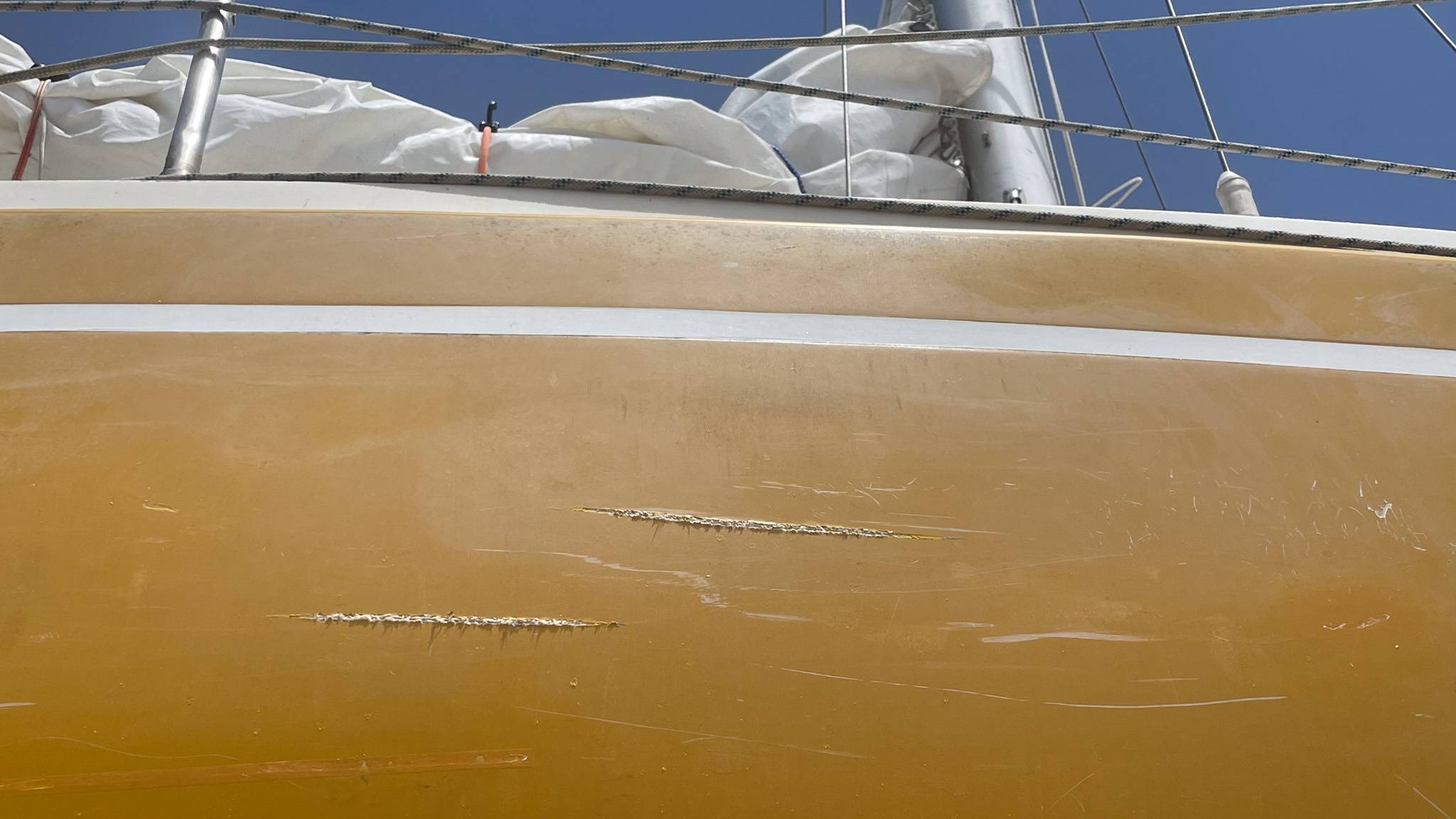 Marks on the side of a boat called Julia following an an orca attack/Ken Browne/CGTN Europe