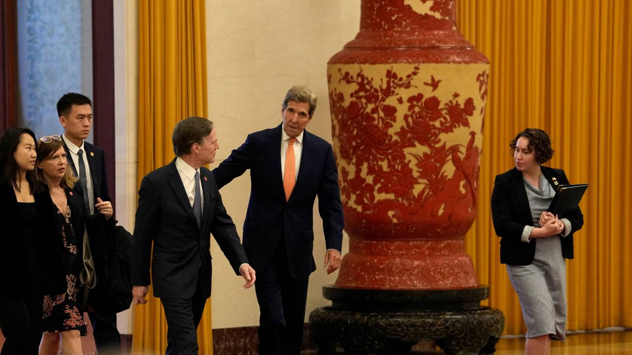 U.S. climate envoy John Kerry walks next to U.S. Ambassador to China Nicholas Burns in Beijing. /Ng Han Guan/Pool/Reuters