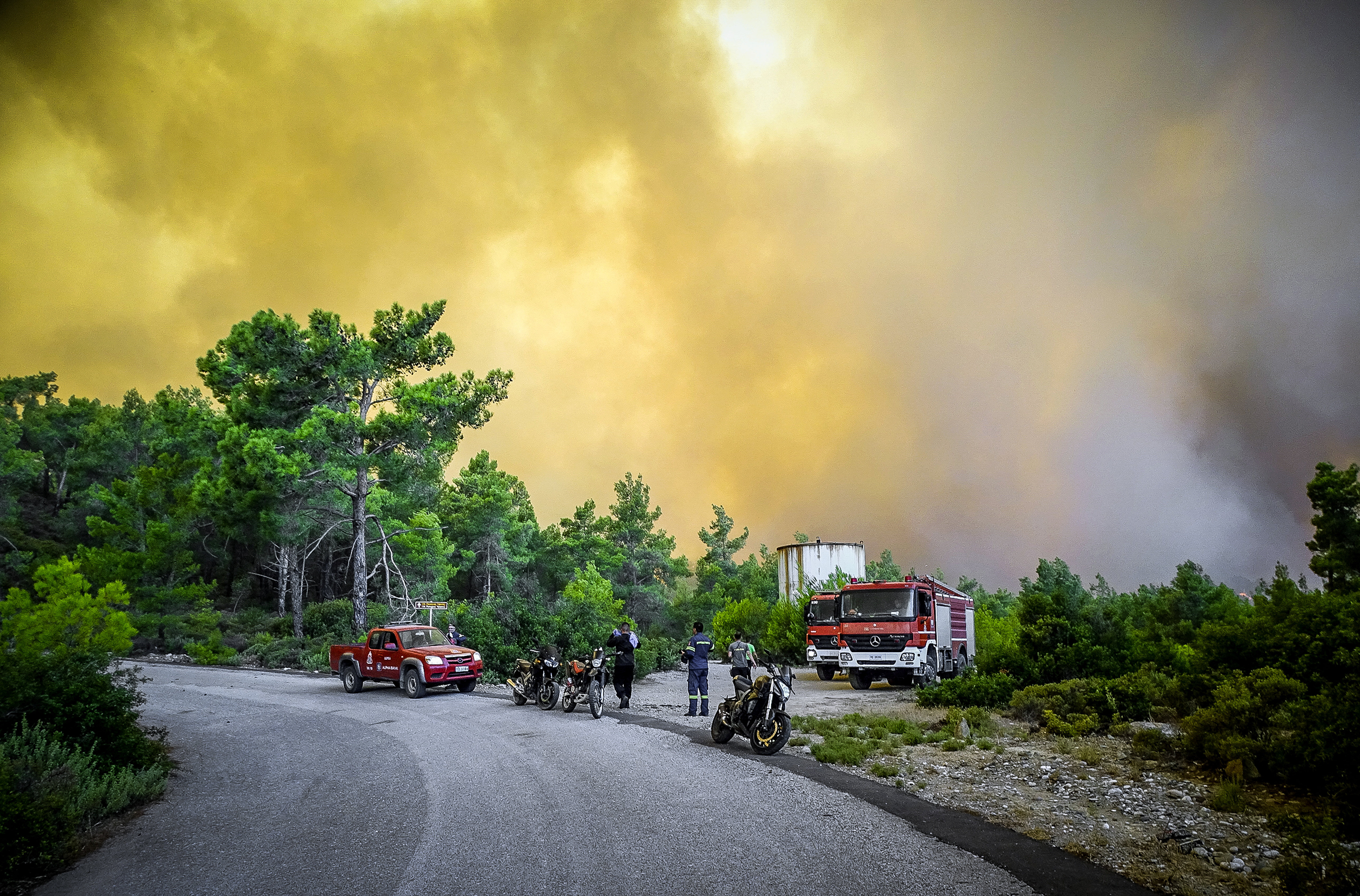 Firefighters seen near a wildfire on the island of Rhodes. Argiris Mantikos/ Eurokinissi/ Reuters