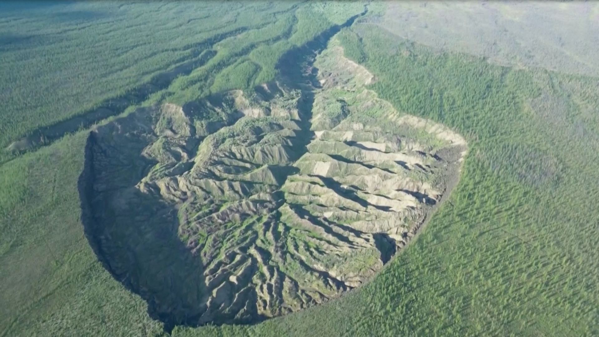 The Batagaika crater is labeled 'gateway to the underworld' by locals. /Reuters