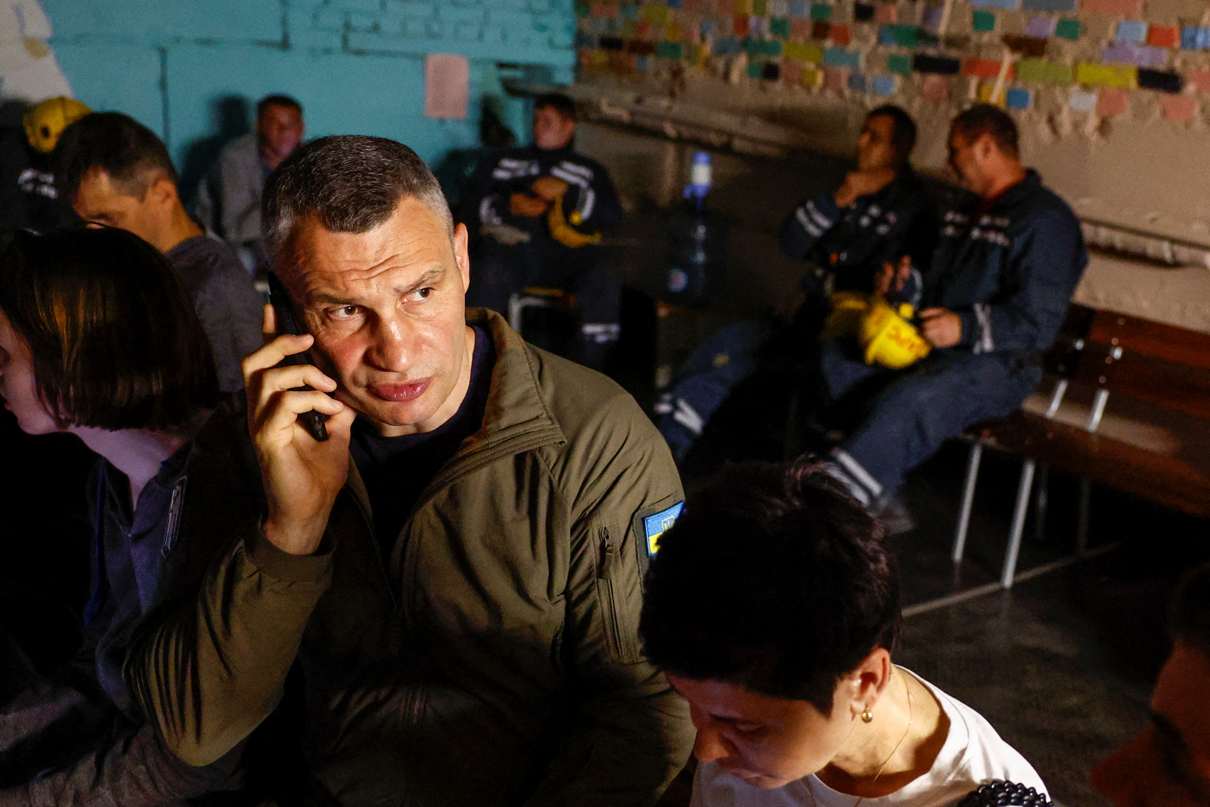 Mayor of Kyiv Vitali Klitschko takes cover inside shelter with local residents during an air raid alert in Kyiv in June. /Valentyn Ogirenko/Reuters