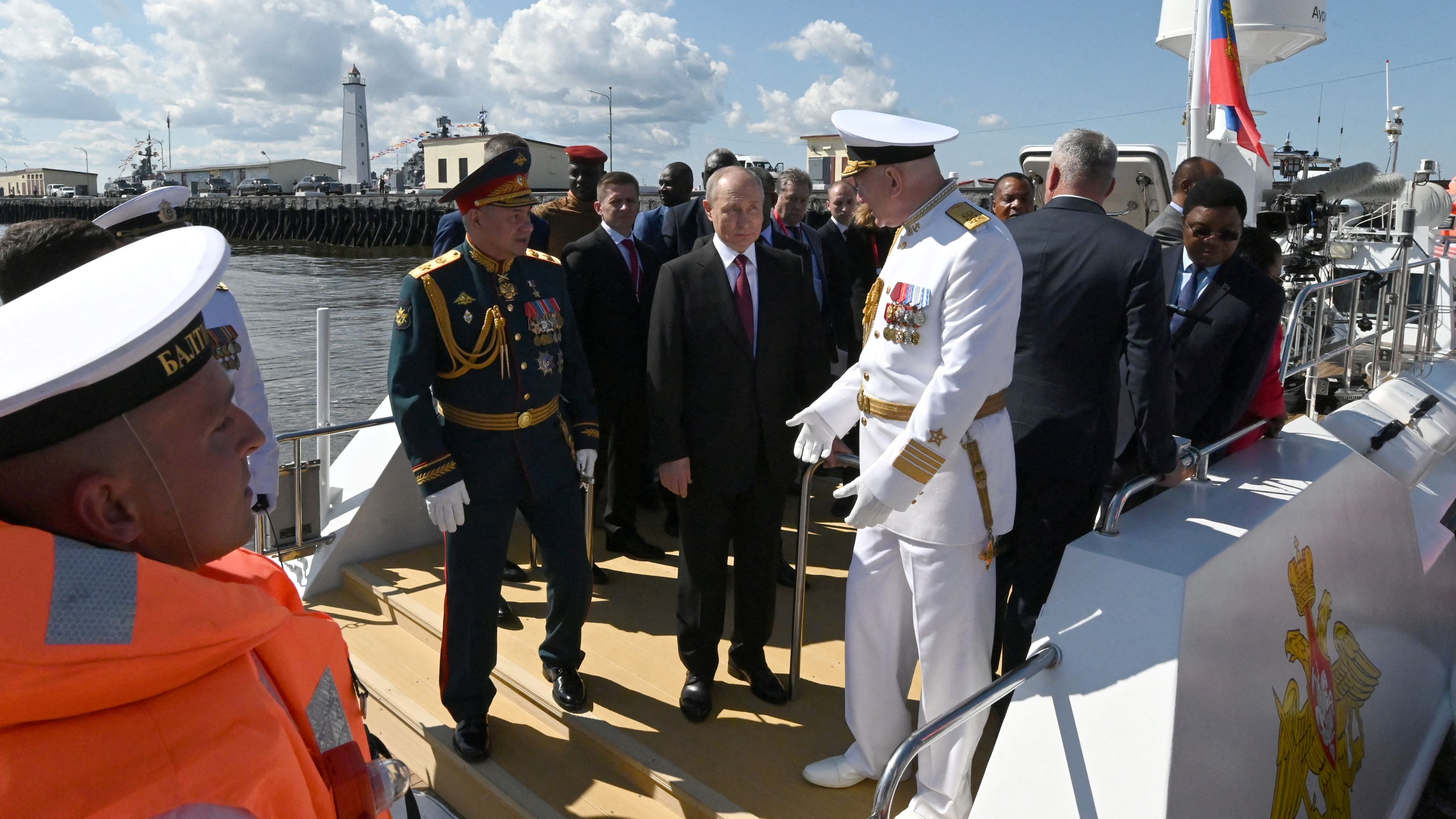 Vladimir Putin onboard a boat during Russia's Navy Day in St. Petersburg./  Sputnik/Alexander Kazakov/Reuters