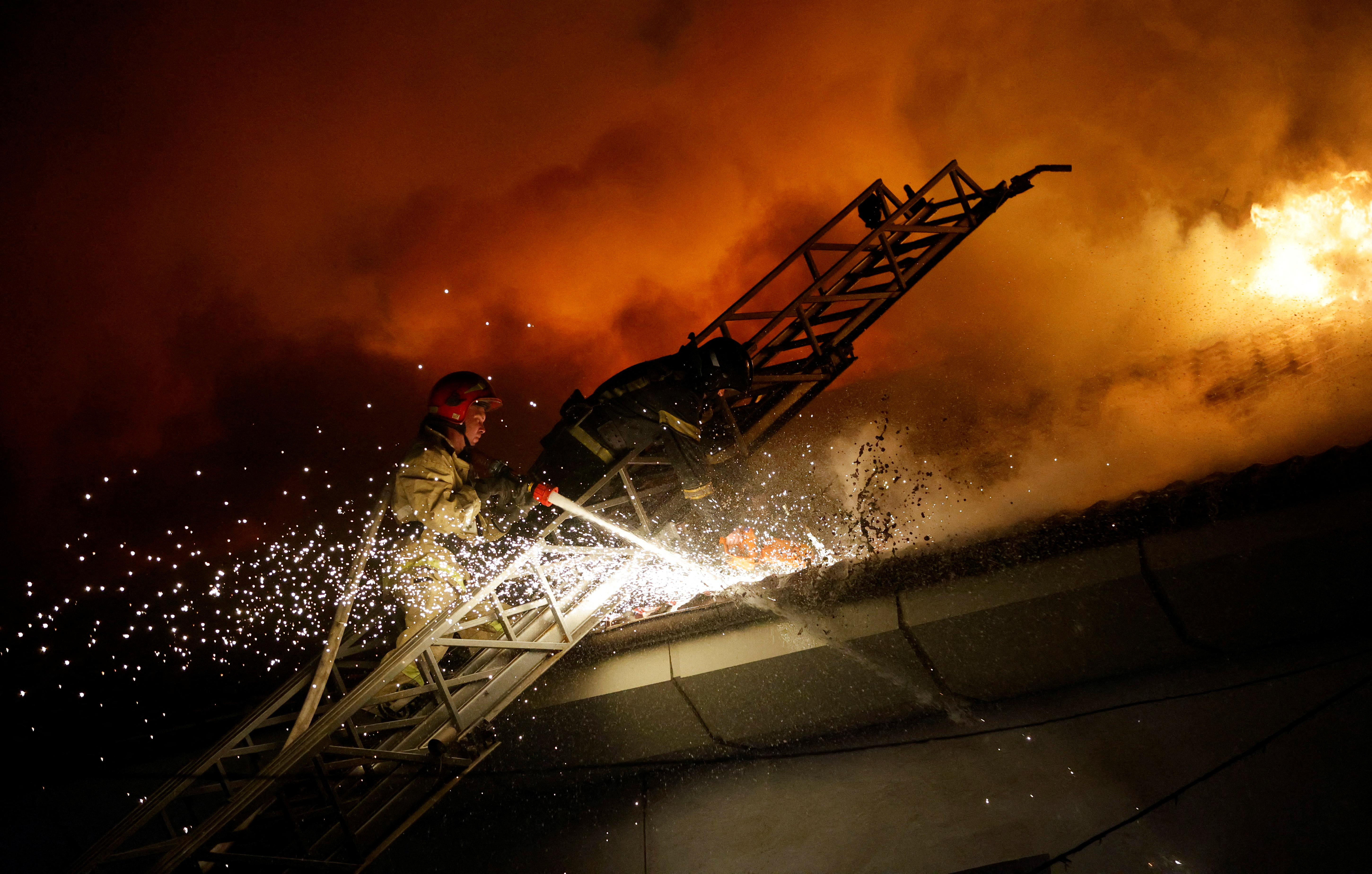 Firefighters extinguish a blaze at a university building in Donetsk. /Alexander Ermochenko/Reuters