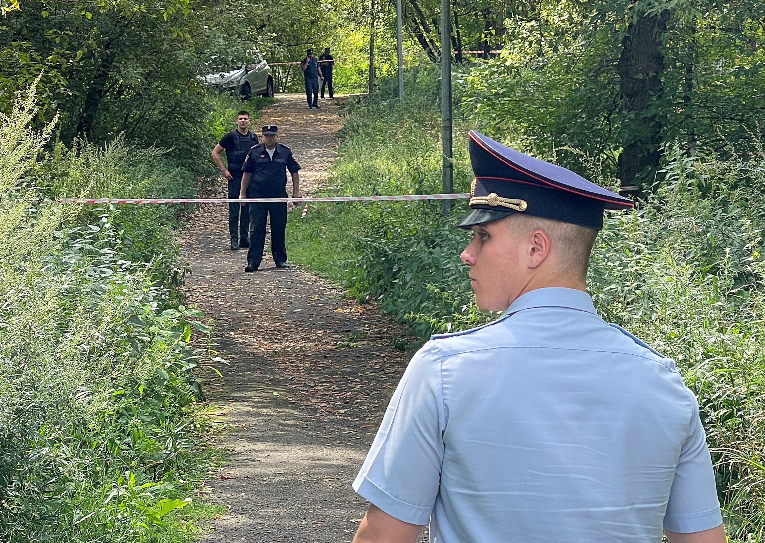 Russian law enforcement officers gather near the accident scene following a Ukrainian drone crash in Moscow. /Reuters