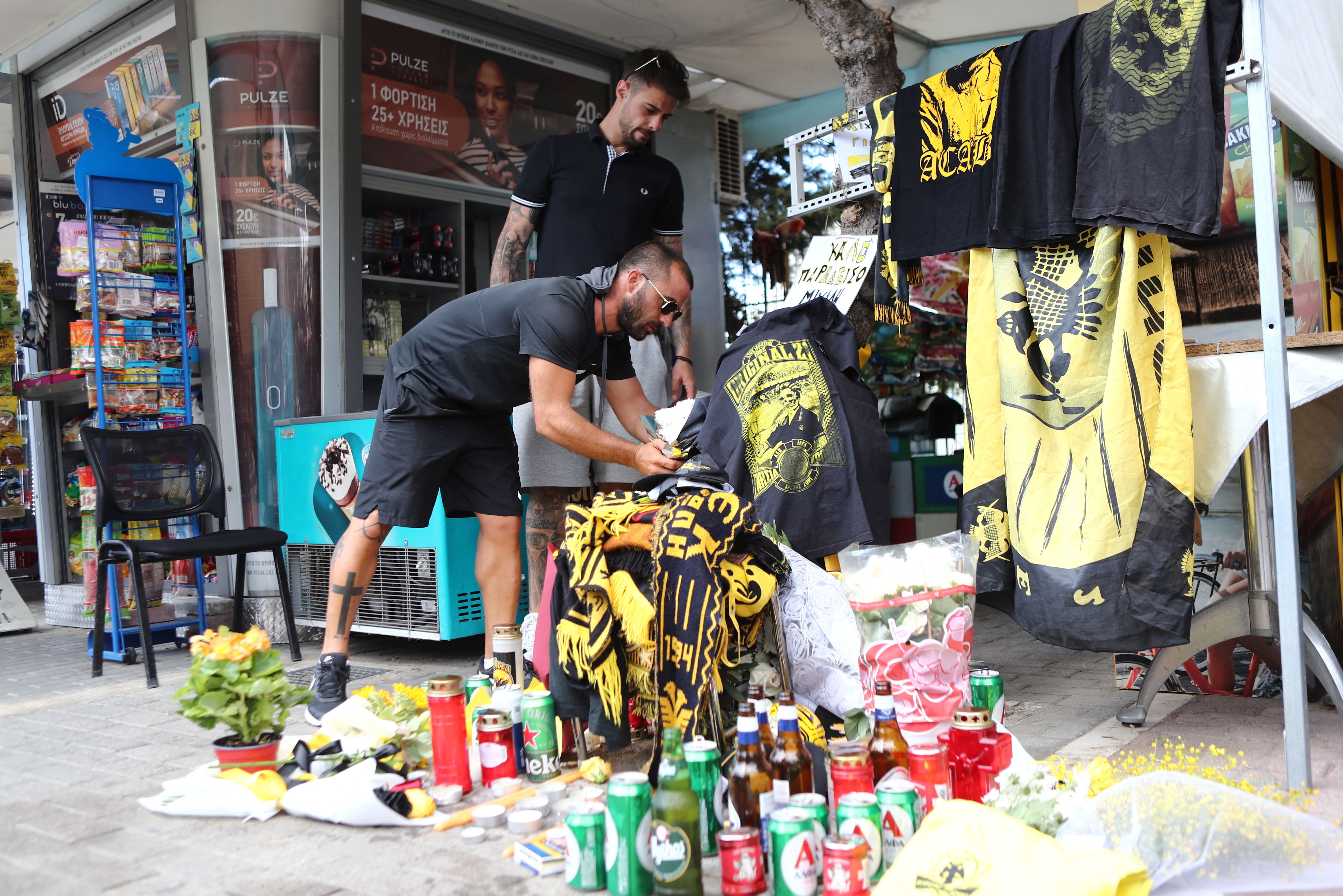 Flowers are left outside AEK Athens' stadium following the death of a fan. /Stelios Stefanou/Eurokinissi/Reuters 