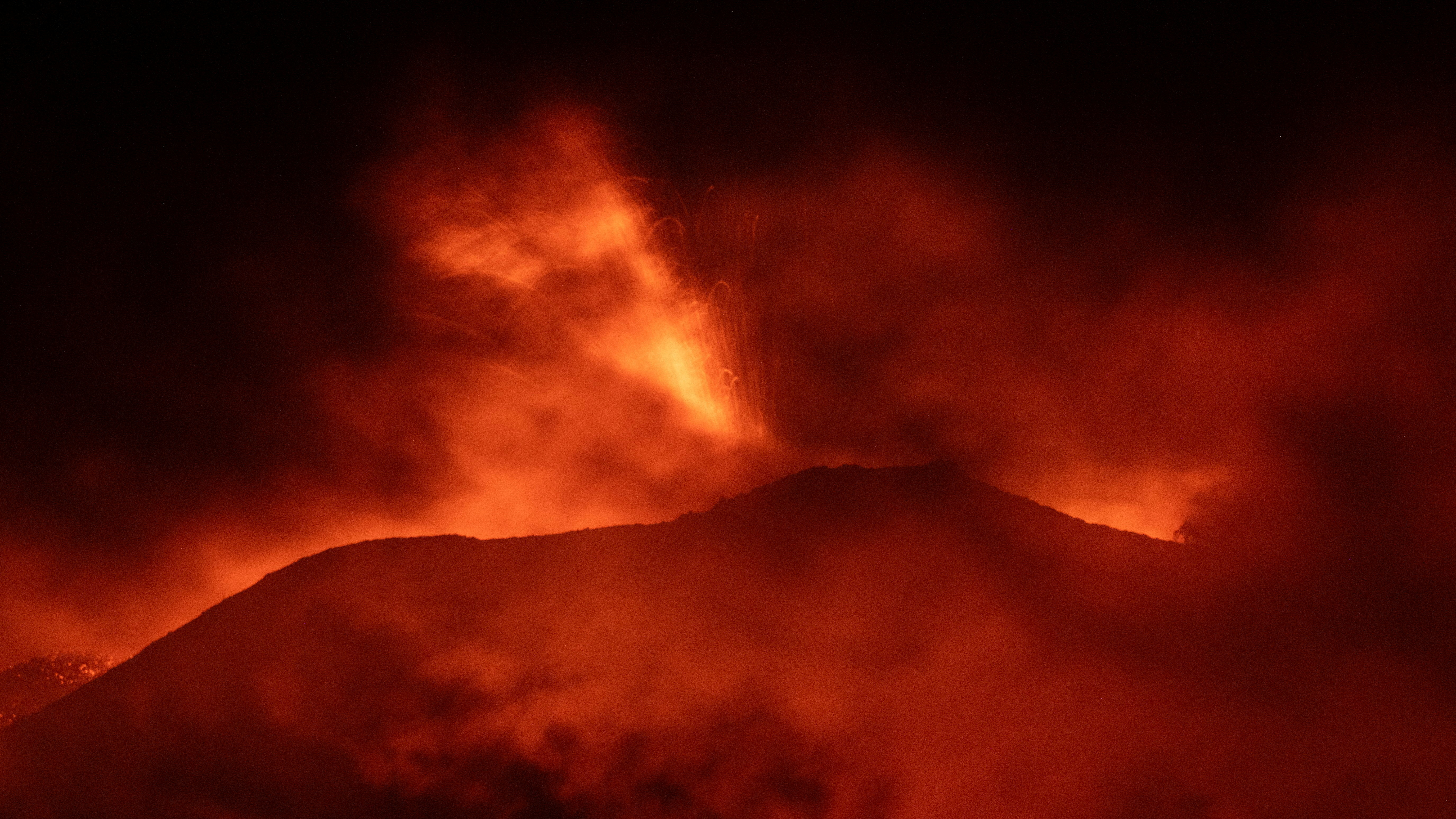 Mount Etna lights up the sky, seen from Rocca Della Valle in Sicily. Etna Walk/ Marco Restivo/ Reuters