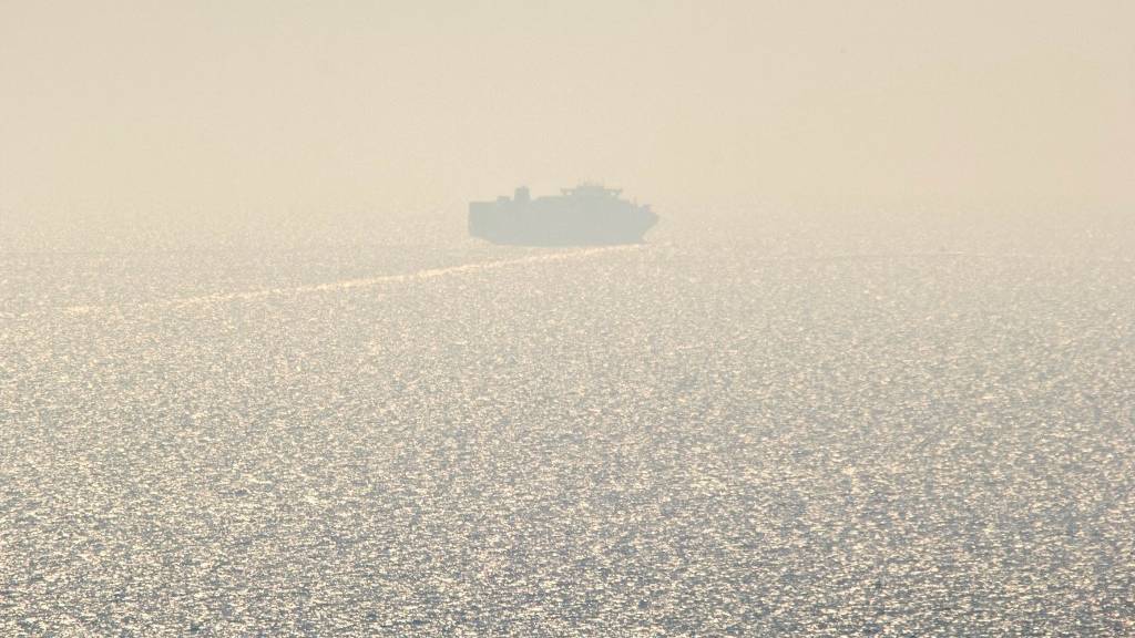 The first cargo ship using new Black Sea shipping lanes is seen leaving the southern port of Odesa. /Stringer/AFP