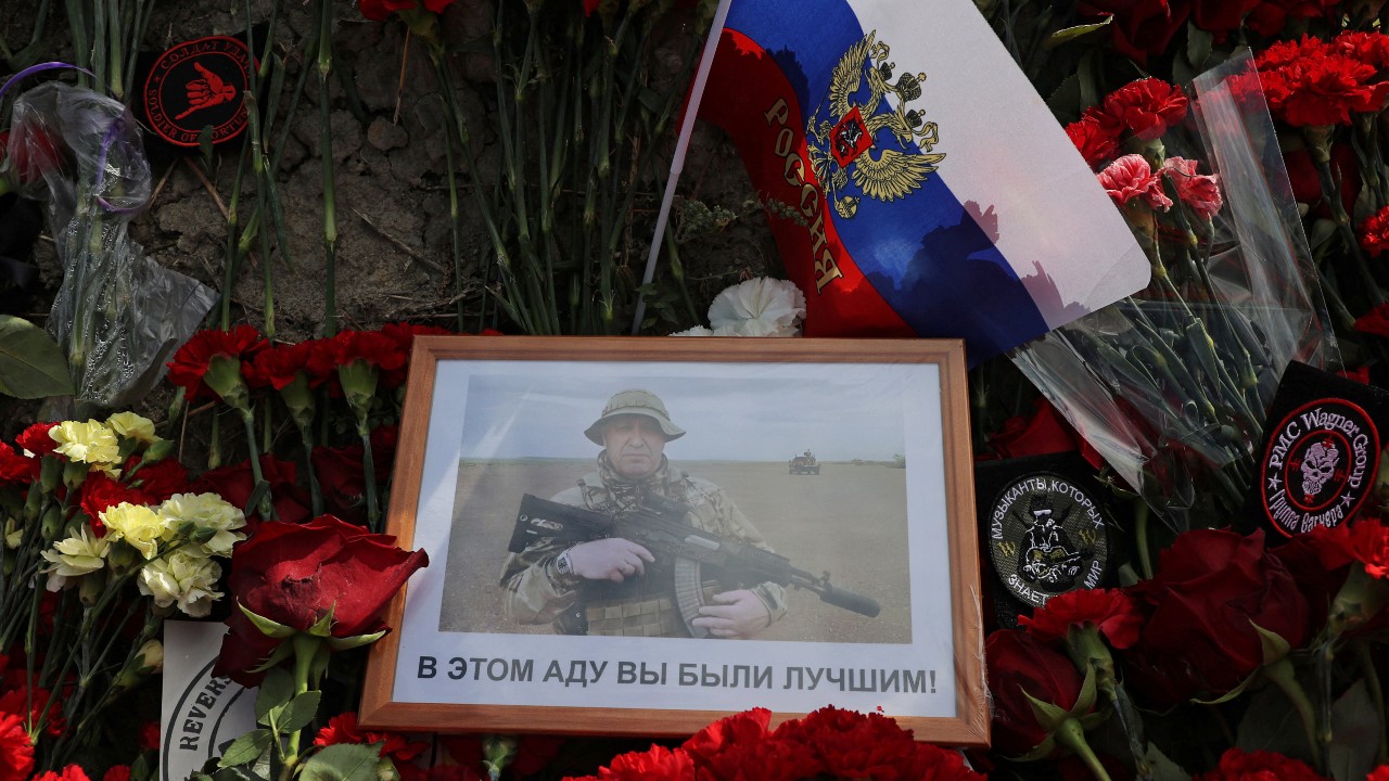 Prigozhin in a photograph at a makeshift memorial in Saint Petersburg. The words read: 'In this hell you were the best!' / Anton Vaganov/Reuters
