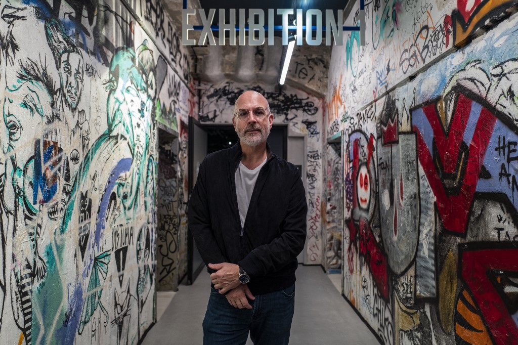 Majority shareholder in Fotografiska Holding AB Yoram Roth poses in hallway of the new Fotografiska museum. /John MacDougall/AFP