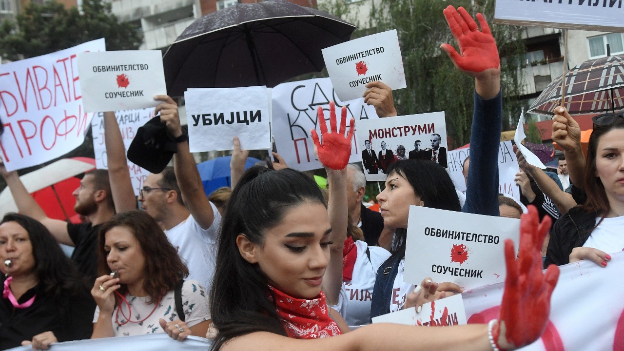 Protesters, some having their hand painted in red, demanded the resignation of government officials and accountability of all involved in the case of stealing expensive cancer therapy from a state clinic, during a demonstration in Skopje. /Robert Atanasovski/AFP
