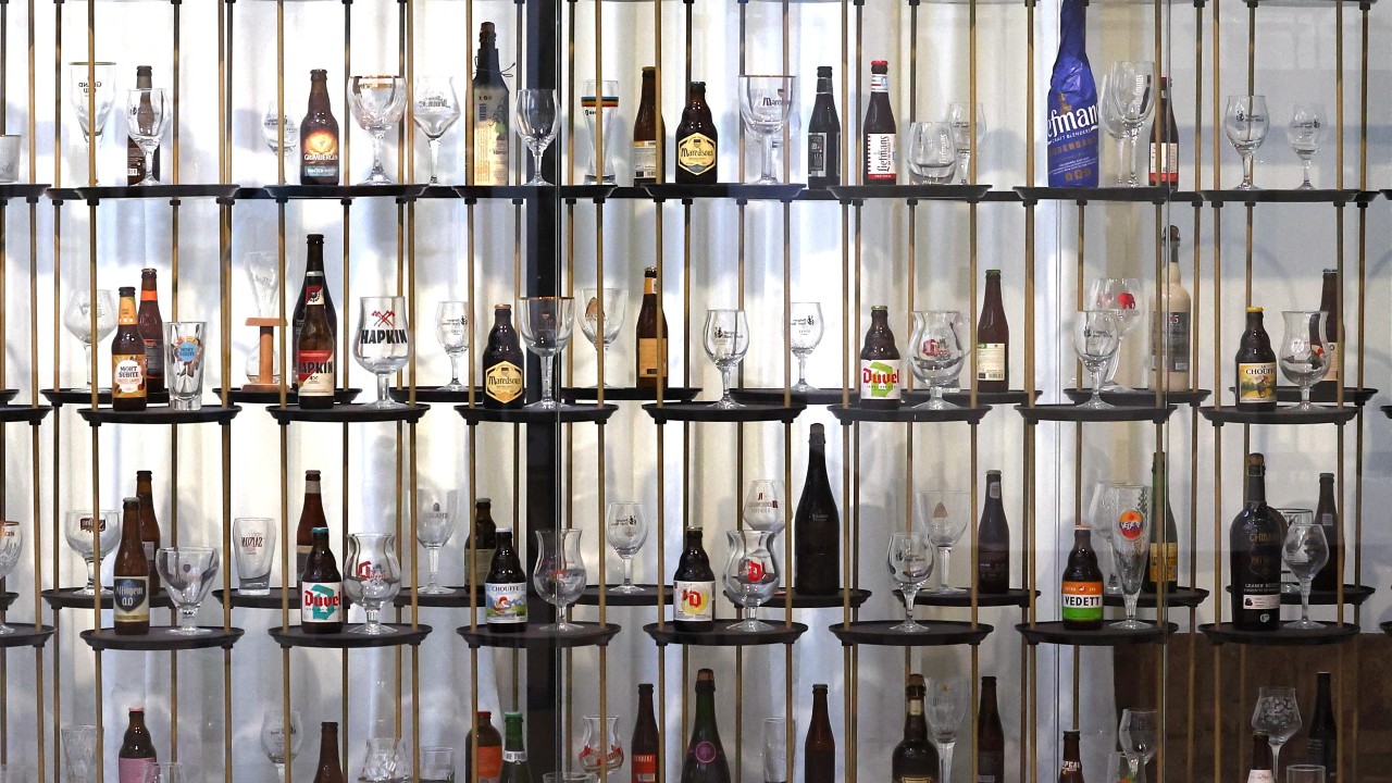 Beer bottles and glasses displayed at the Belgian Beer World, the world's largest interactive experience center about beer. /Yves Herman/Reuters