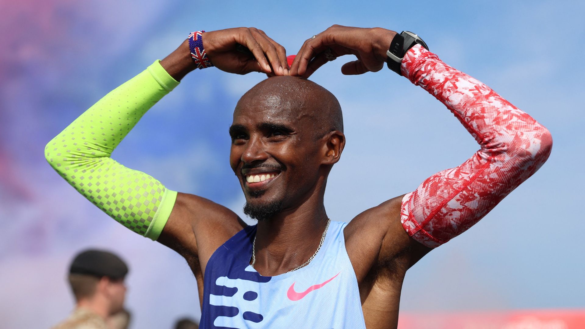 Britain's Mo Farah poses after his last ever race. /Lee Smith/Reuters
