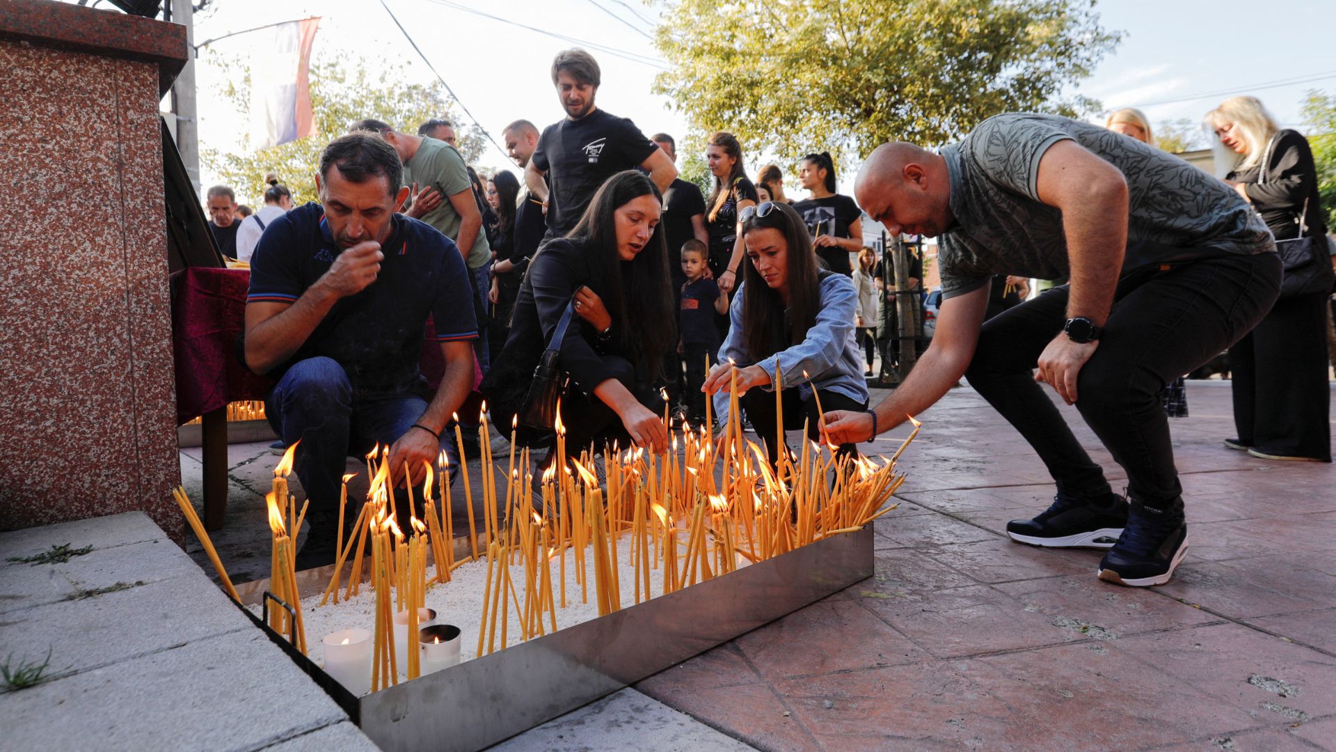 Kosovo Serbs hold a vigil for Serbs killed on Sunday. /Ognen Teofilovski/Reuters
