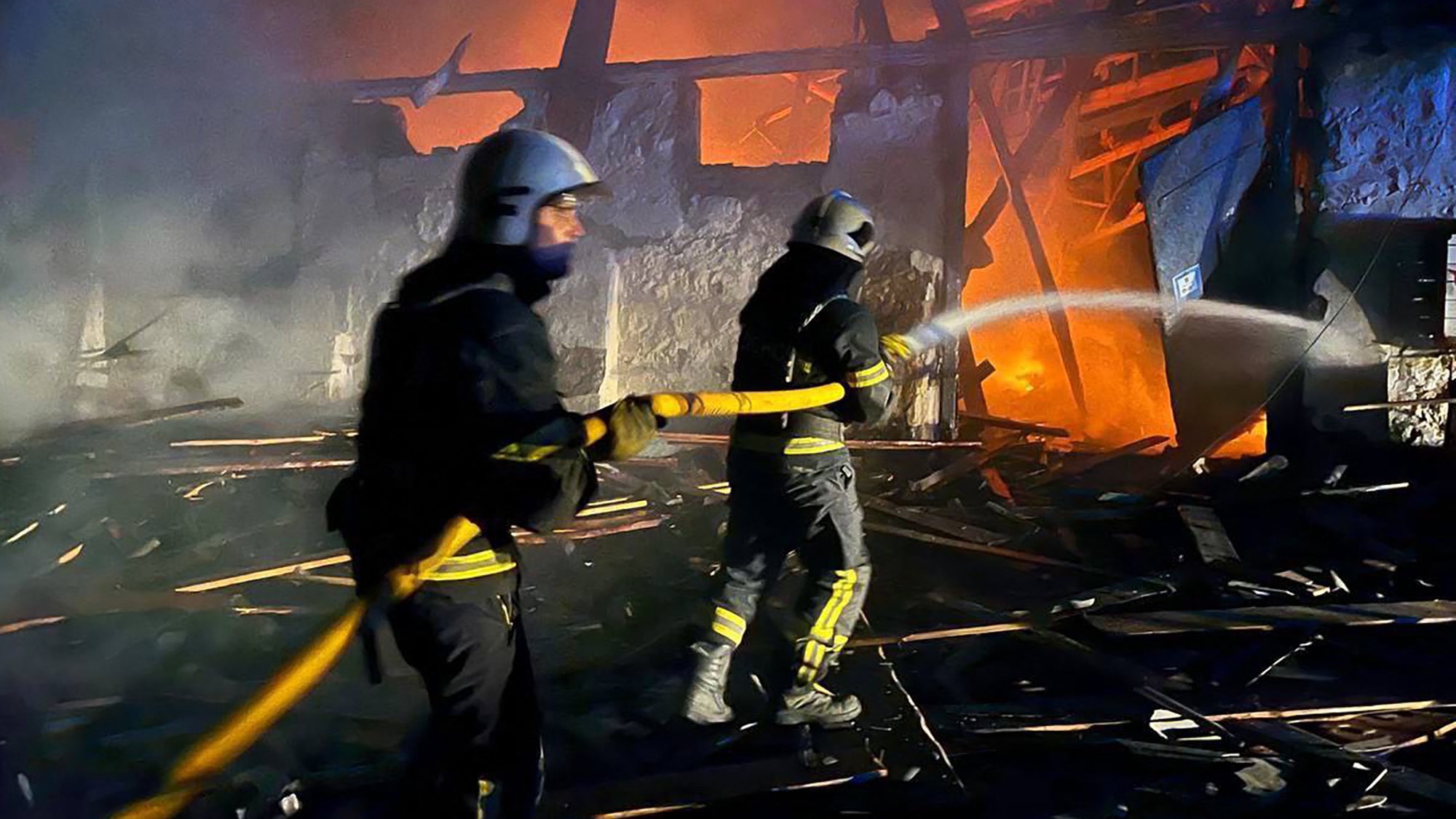 Rescuers put out a fire following a drone attack on an industrial facility in Uman, Cherkasy region. /Ukrainian Emergency Service/AFP