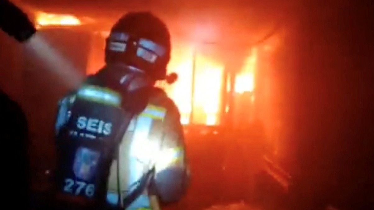 Firefighters work to control flames inside a nightclub in Murcia, Spain. /Murcia Firefighters/Reuters