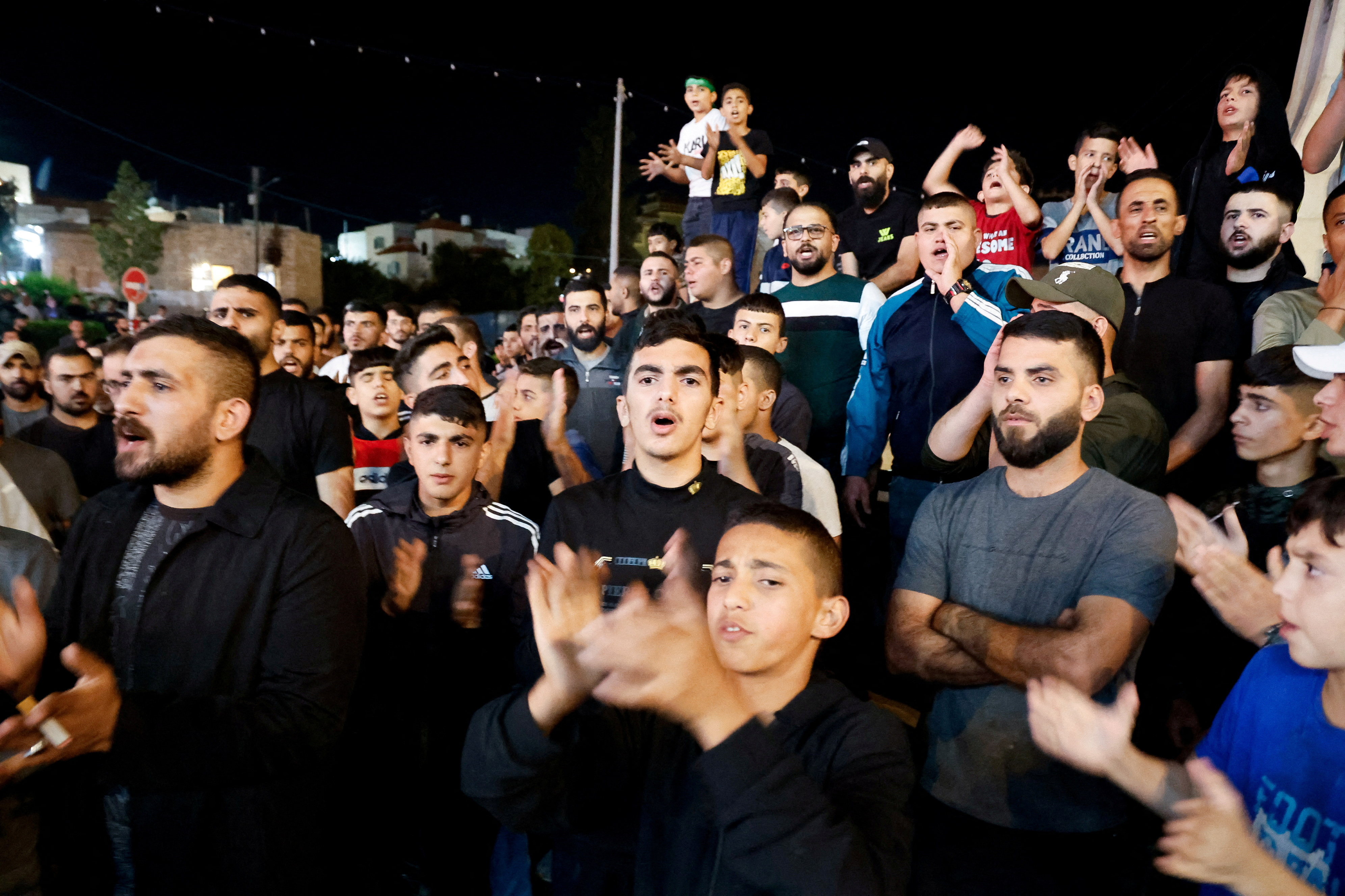 Palestinians take part in a protest after hundreds of Palestinians were killed in a blast at Al-Ahli hospital in Gaza. /Raneen Sawafta/Reuters