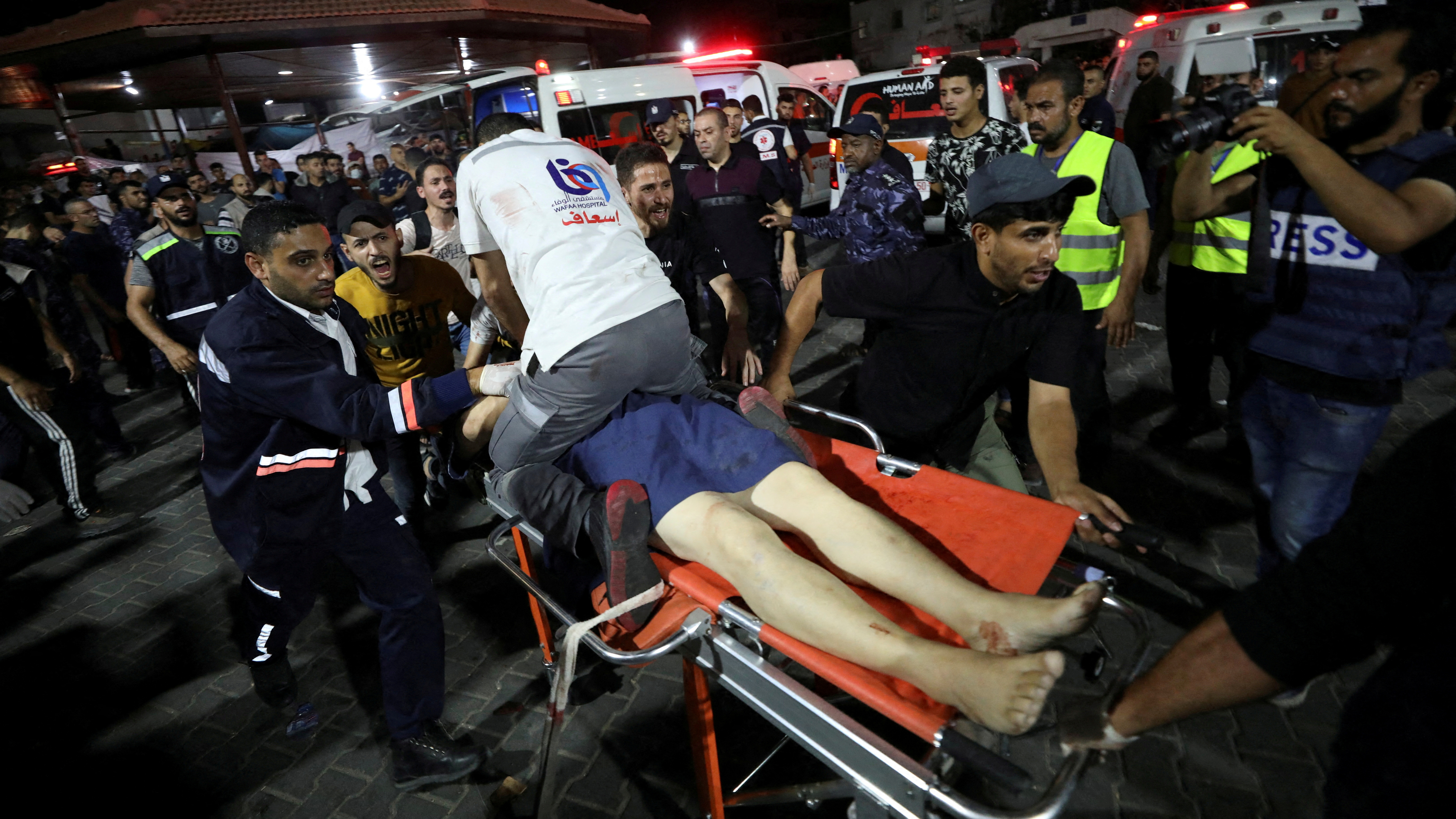 An injured person receives help at Shifa Hospital after the blast. /Mohammed Al-Masri/Reuters