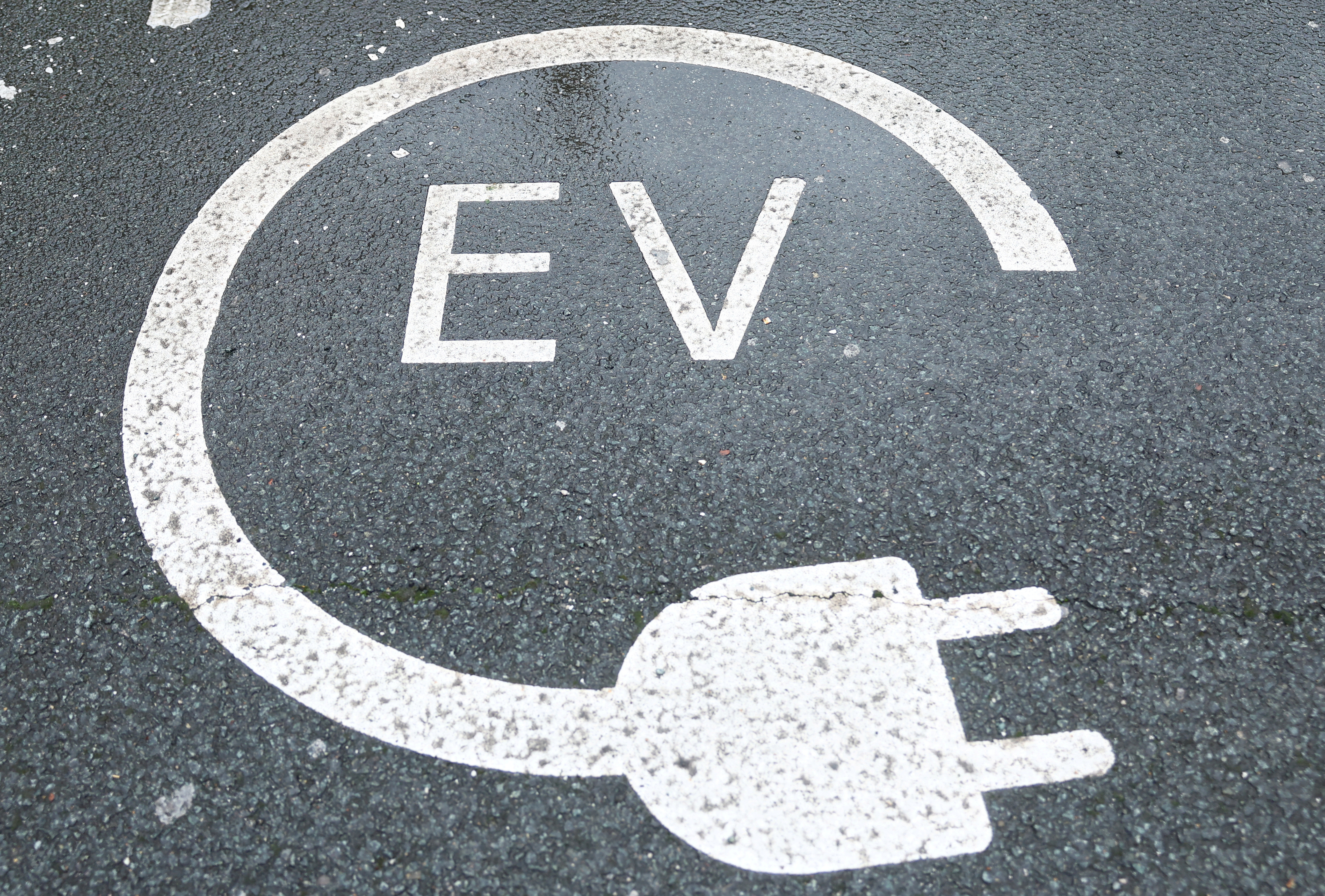 EV infrastructure, such as charging points for vehicles, must keep pace with the sales of EVs. /Reuters/Molly Darlington