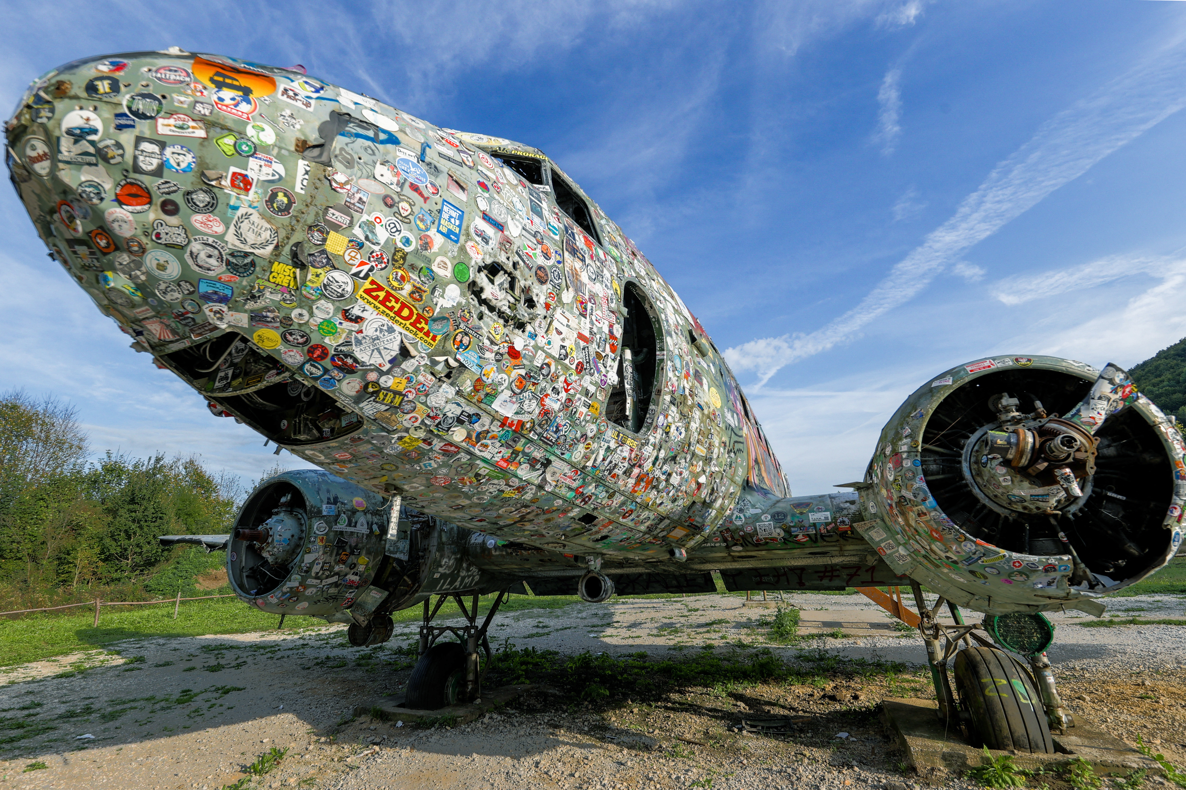 A Douglas C-47 B Dakota American army plane covered with stickers at the Zeljava base. /Damir Sencar/AFP