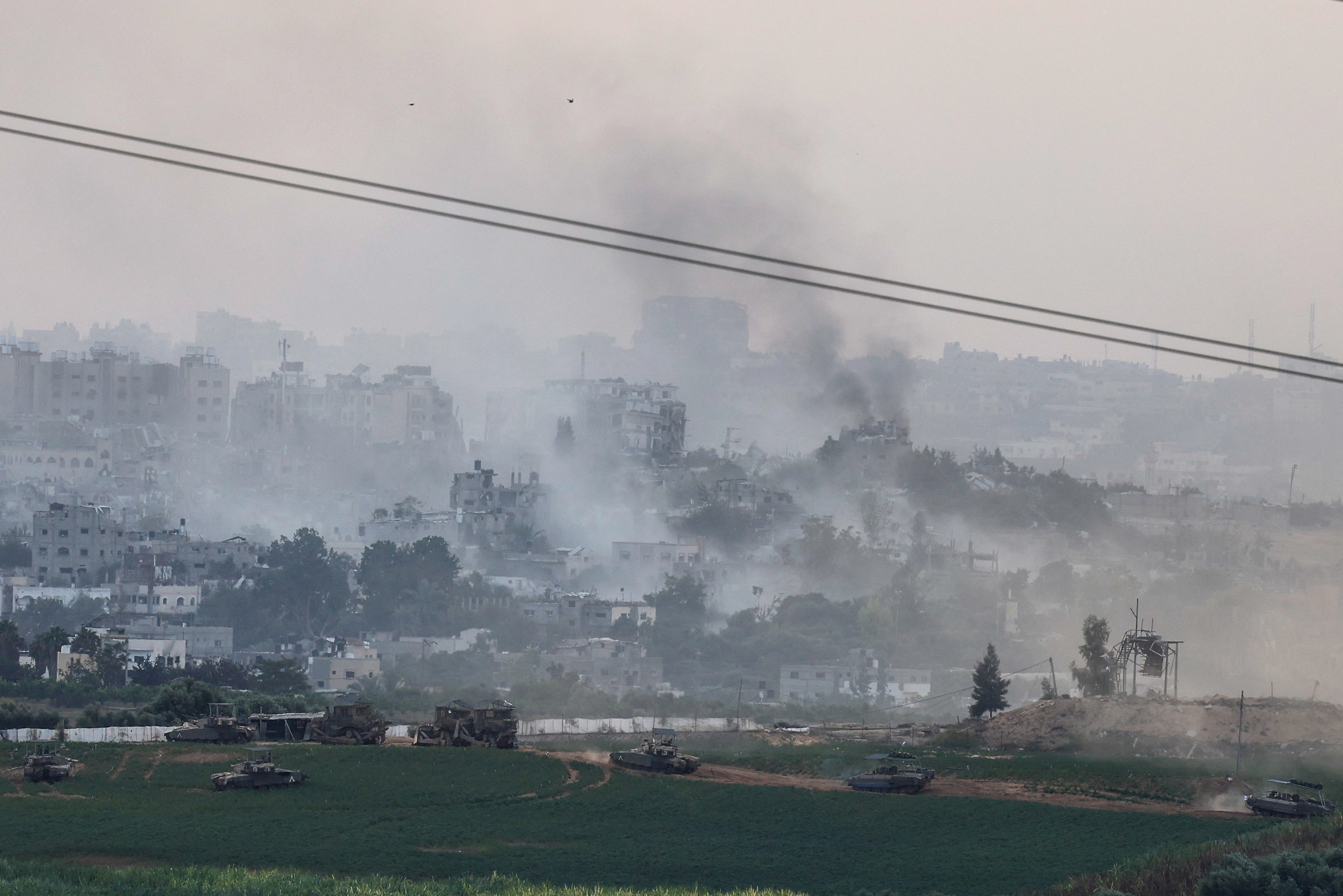 Smoke rises over Gaza as Israeli tanks begin their ground offensive. /Evelyn Hockstein/Reuters