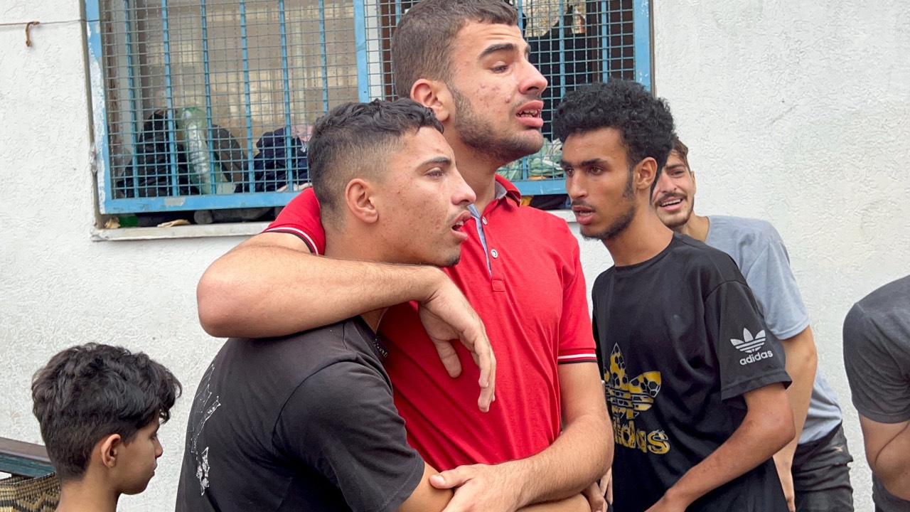 Palestinians at a UN-run school sheltering displaced people, following an Israeli strike, in Jabalia in the northern Gaza Strip. /Fadi Whadi/Reuters