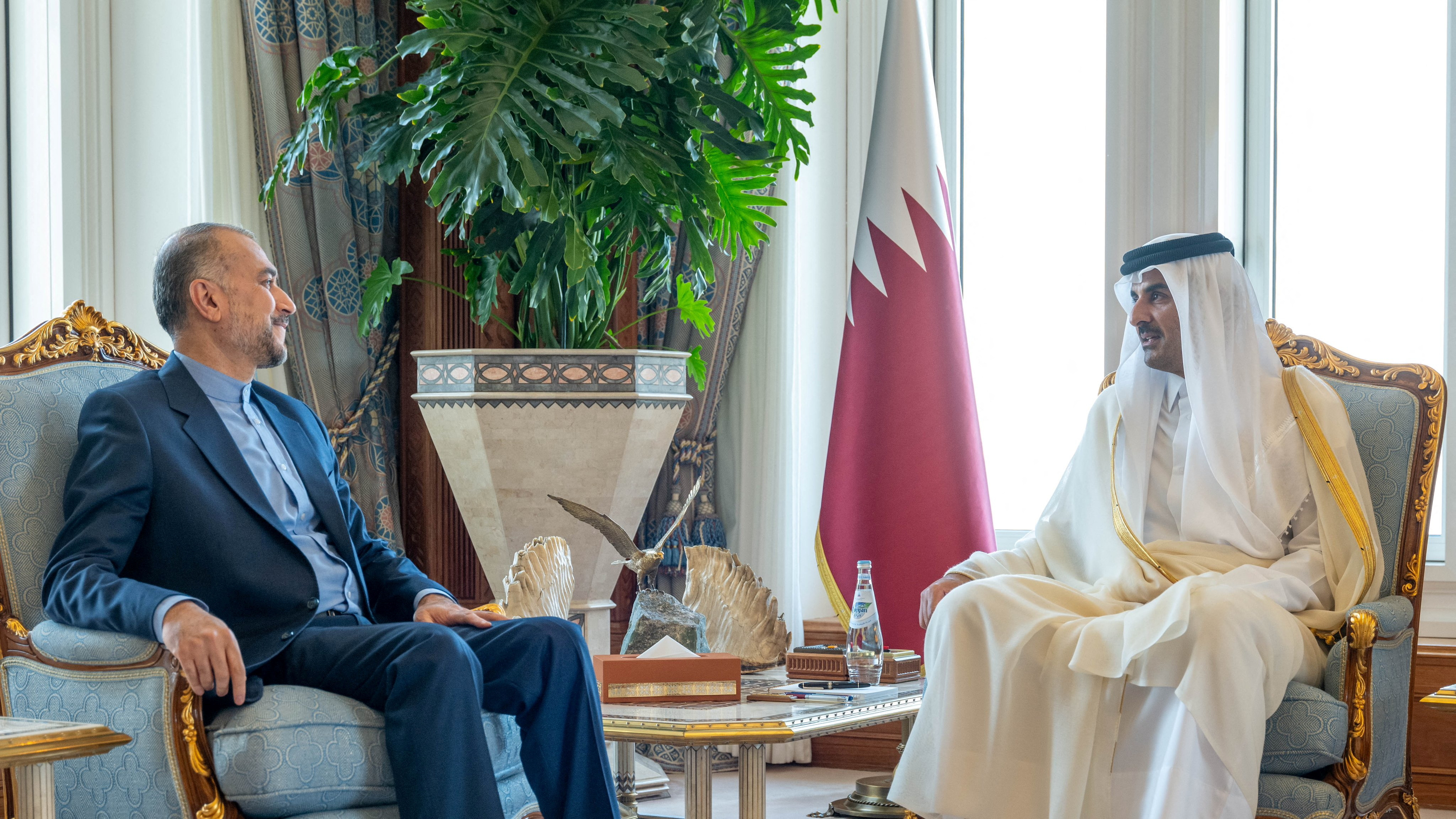 Qatar's Emir Sheikh Tamim bin Hamad al-Thani (r) meets Iran's Foreign Minister Hossein Amir-Abdollahian (l), in Doha. Amir-Abdollahian said in the meeting that the 'expansion of the scope of the war has become inevitable.' /Amiri Dirwan/Reuters
