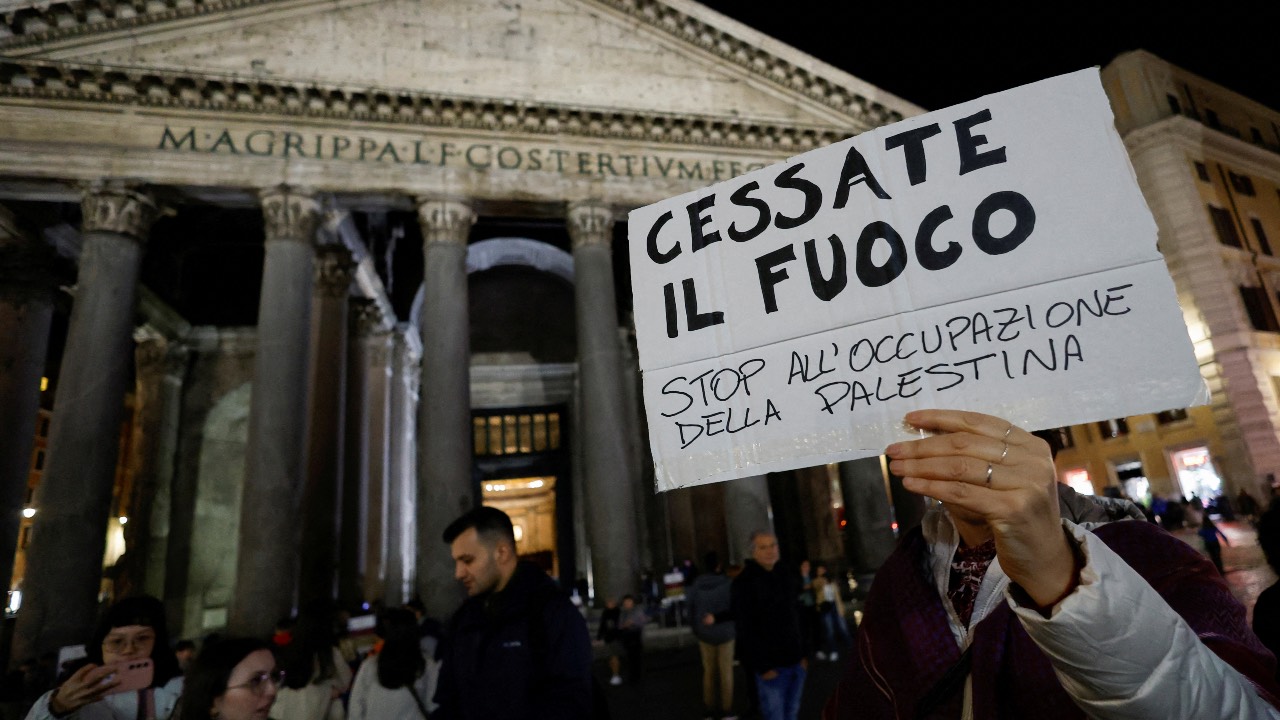 People demonstrate in front of the Pantheon in solidarity with Palestinians in Gaza, in Rome, Italy. The banner reads: 
