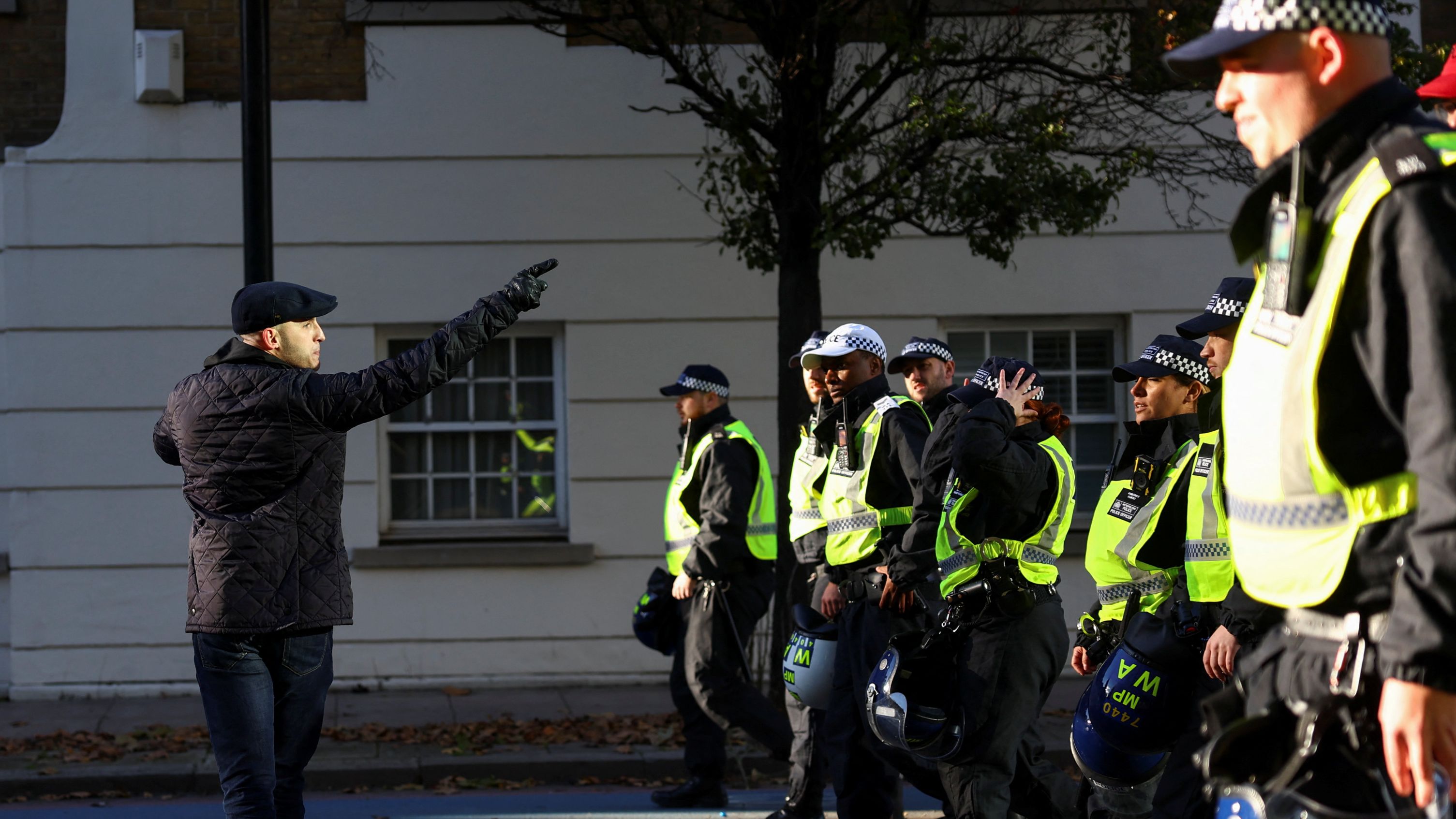 Counter-protesters confront police in London on Saturday./ Hannah McKay/Reuters