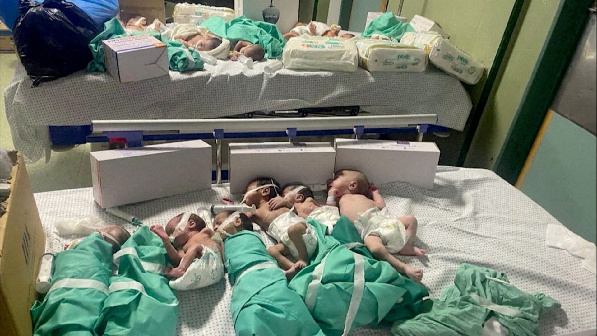 Newborns are placed in bed after being taken off incubators in Gaza's Al Shifa hospital after power outage. /Reuters