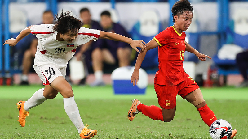 Zhang Linyan, right, in action for China against the Democratic People's Republic of Korea in last month's 2-1 Olympic qualifying defeat in Xiamen. /CFP