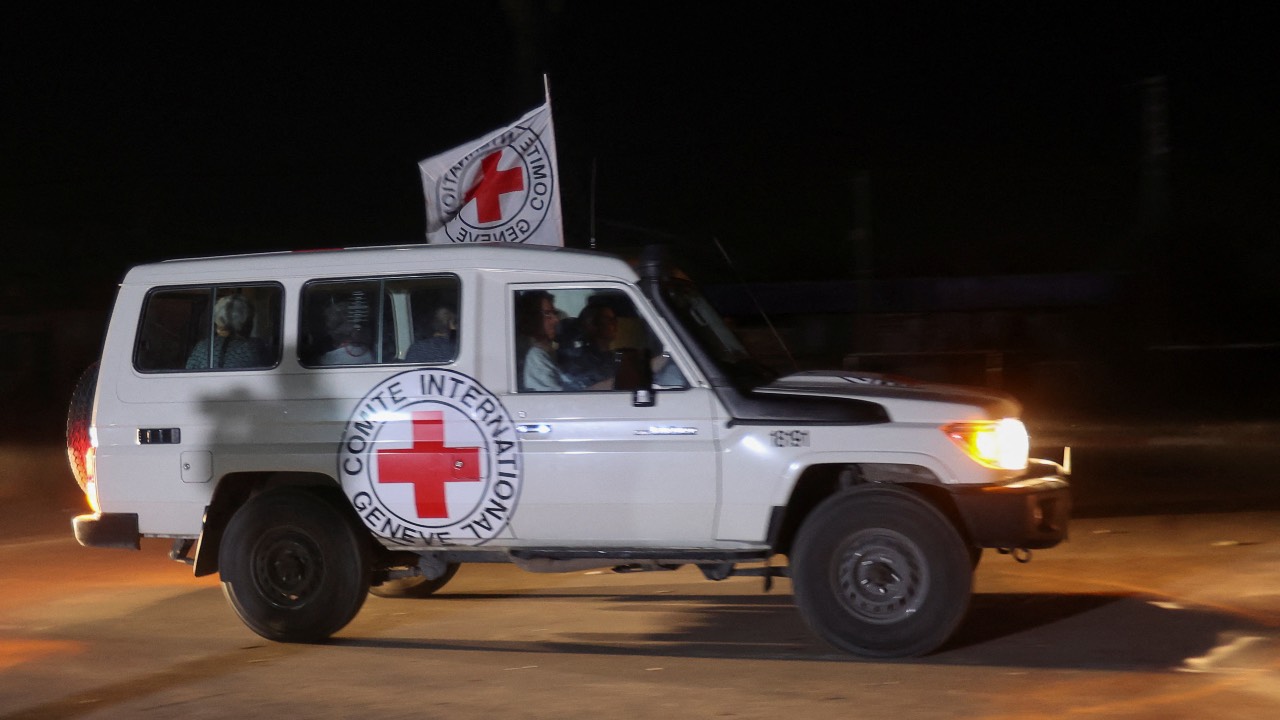 A Red Cross vehicle, as part of a convoy believed to be carrying hostages released by Hamas, arrives at the Rafah border in the southern Gaza Strip. /Ibraheem Abu Mustafa/Reuters