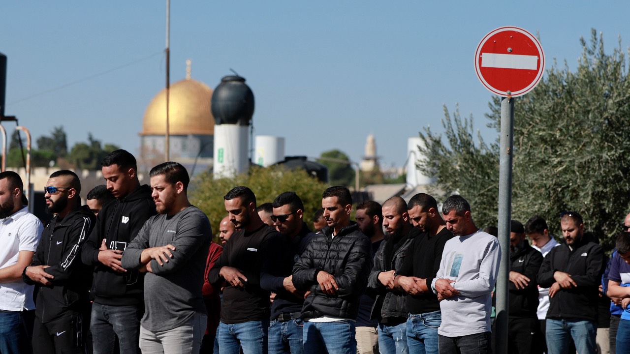Muslim Palestinians hold Friday prayers, amid a temporary truce in Gaza between Hamas and Israel, in Jerusalem. /Ammar Awad/Reuters