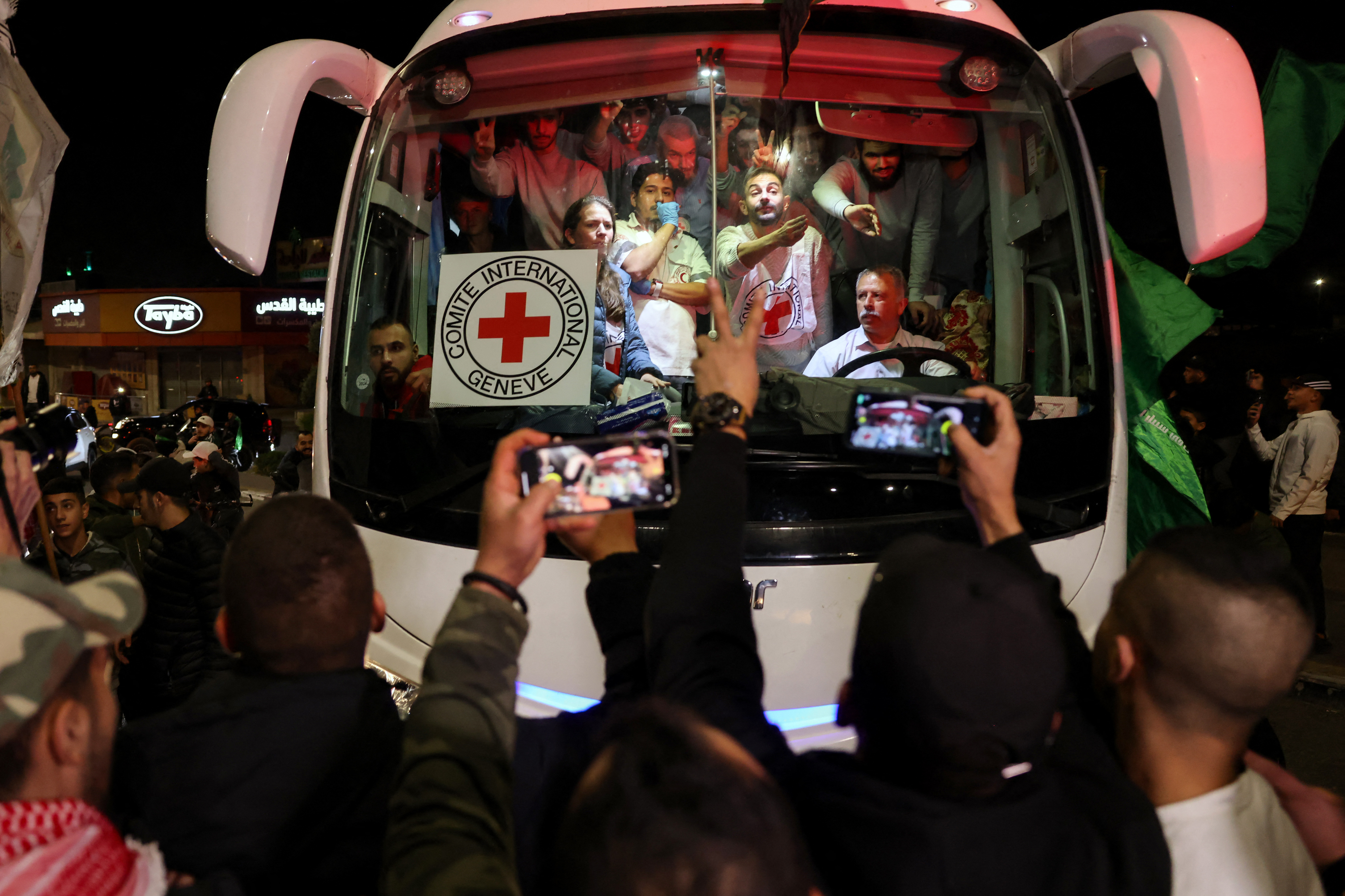 A bus transporting Red Cross staff and Palestinians prisoners released from Israeli jails. /Ahmad Gharabli/AFP