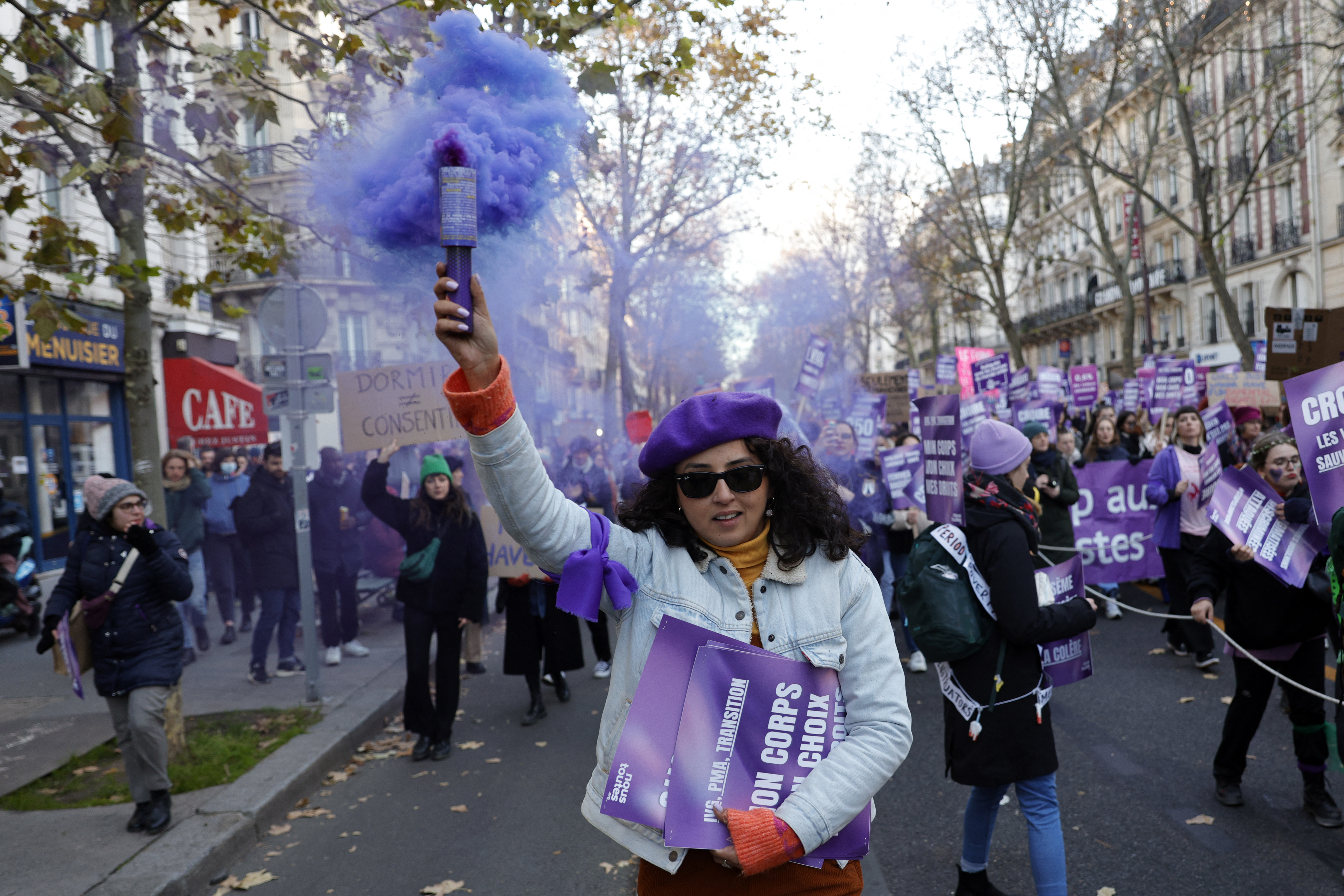 People dressed up in purple in Paris for a march on Saturday. /Geoffroy Van der Hasselt/AFP