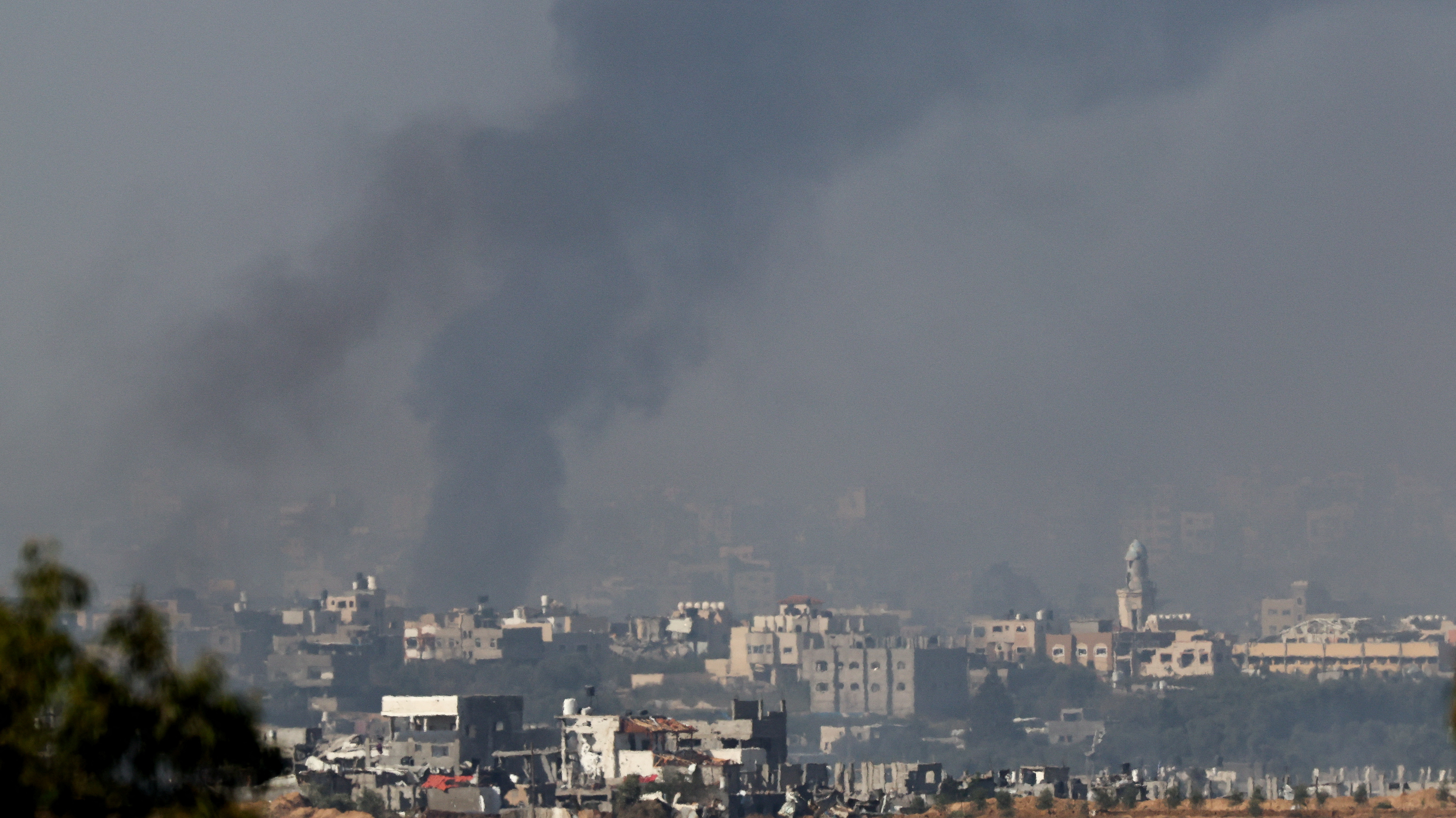 Smoke rises above Gaza on Monday. /Athit Perawongmetha/Reuters