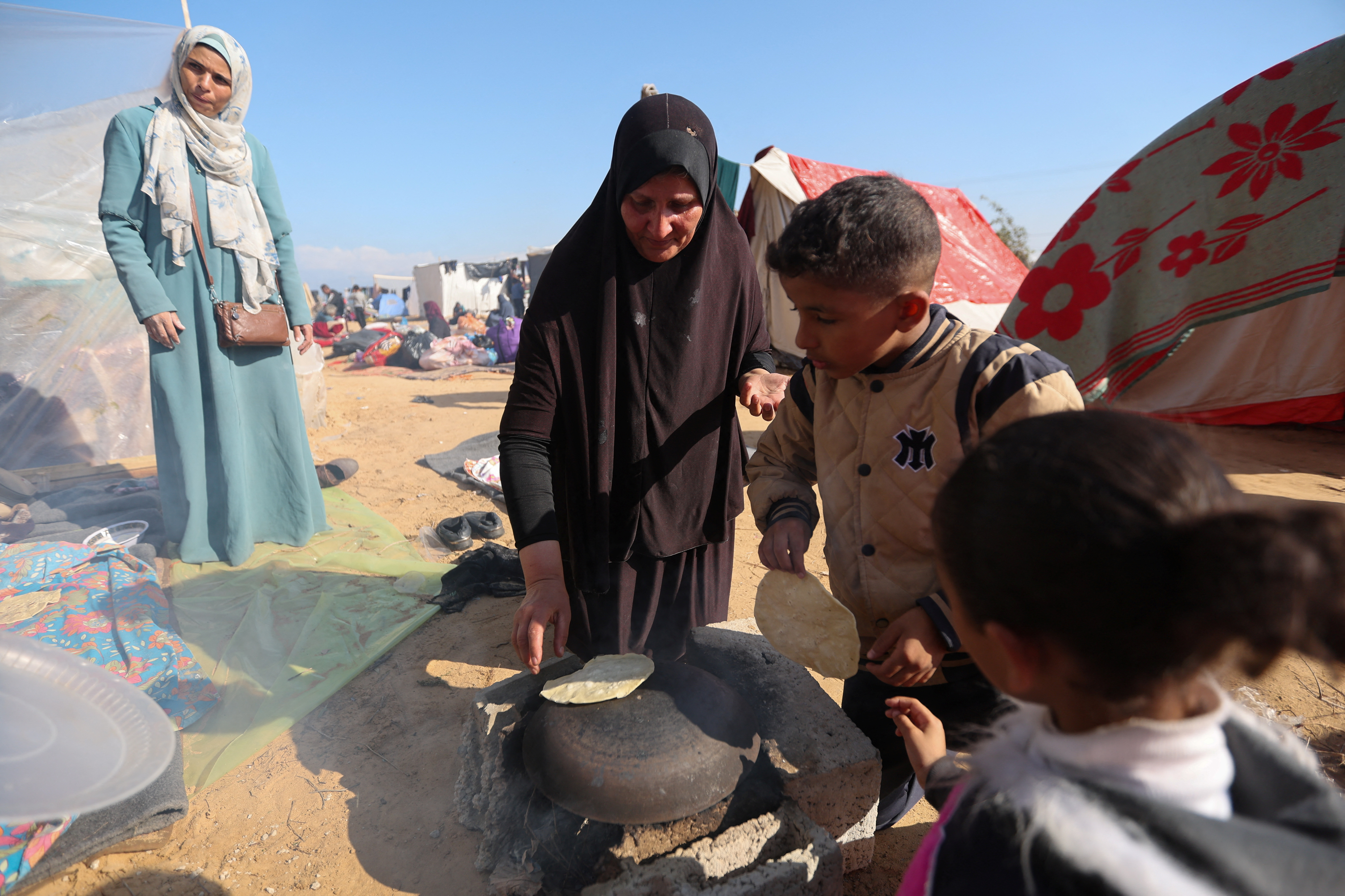 Israel has shifted its focus to the south of the strip, resulting in hundreds of thousands of people being displaced from their homes and living in refugee camps, like this one in Rafah. /Reuters/Ibraheem Abu Mustafa.